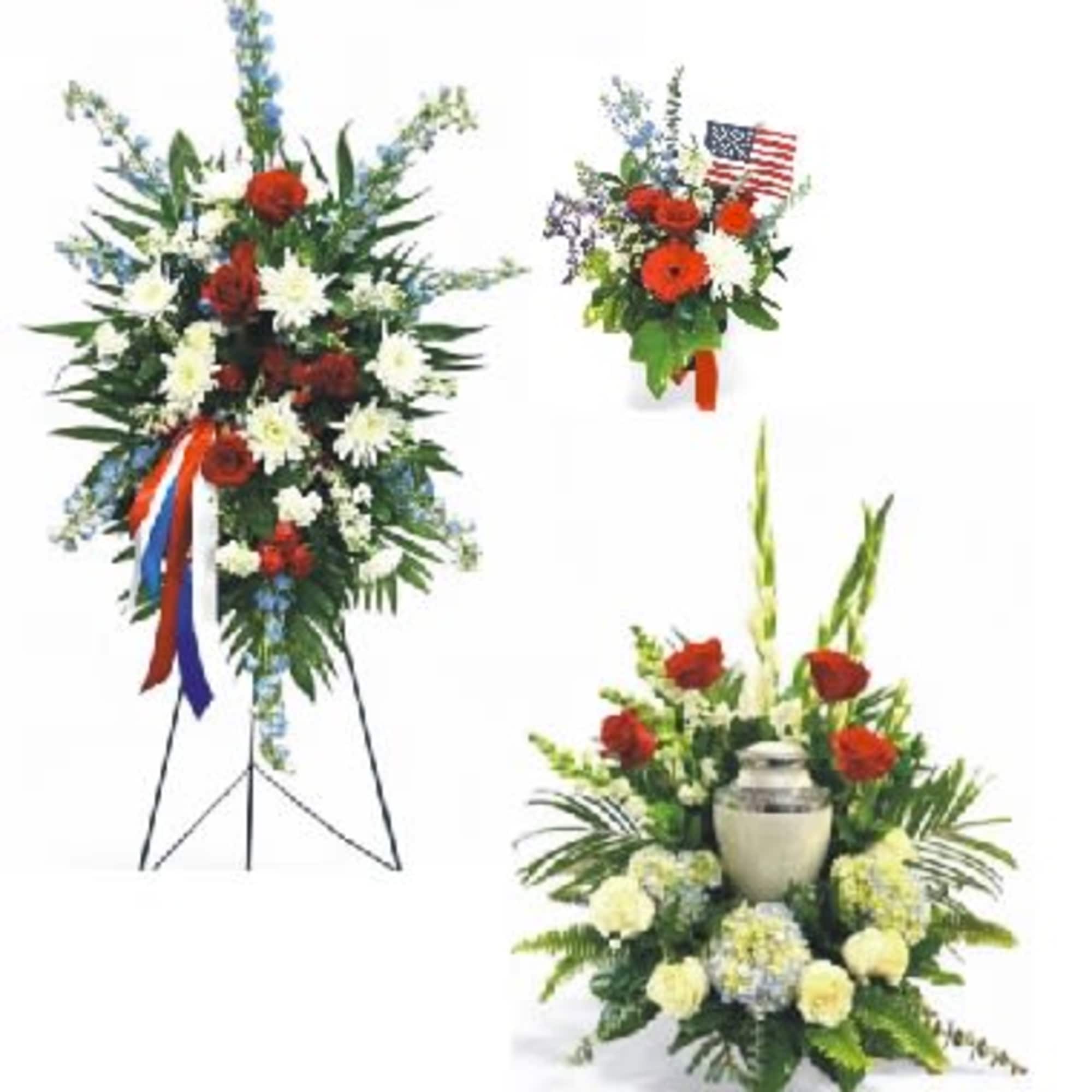 Floral standing sprays with red, white, and blue flowers and an urn centerpiece