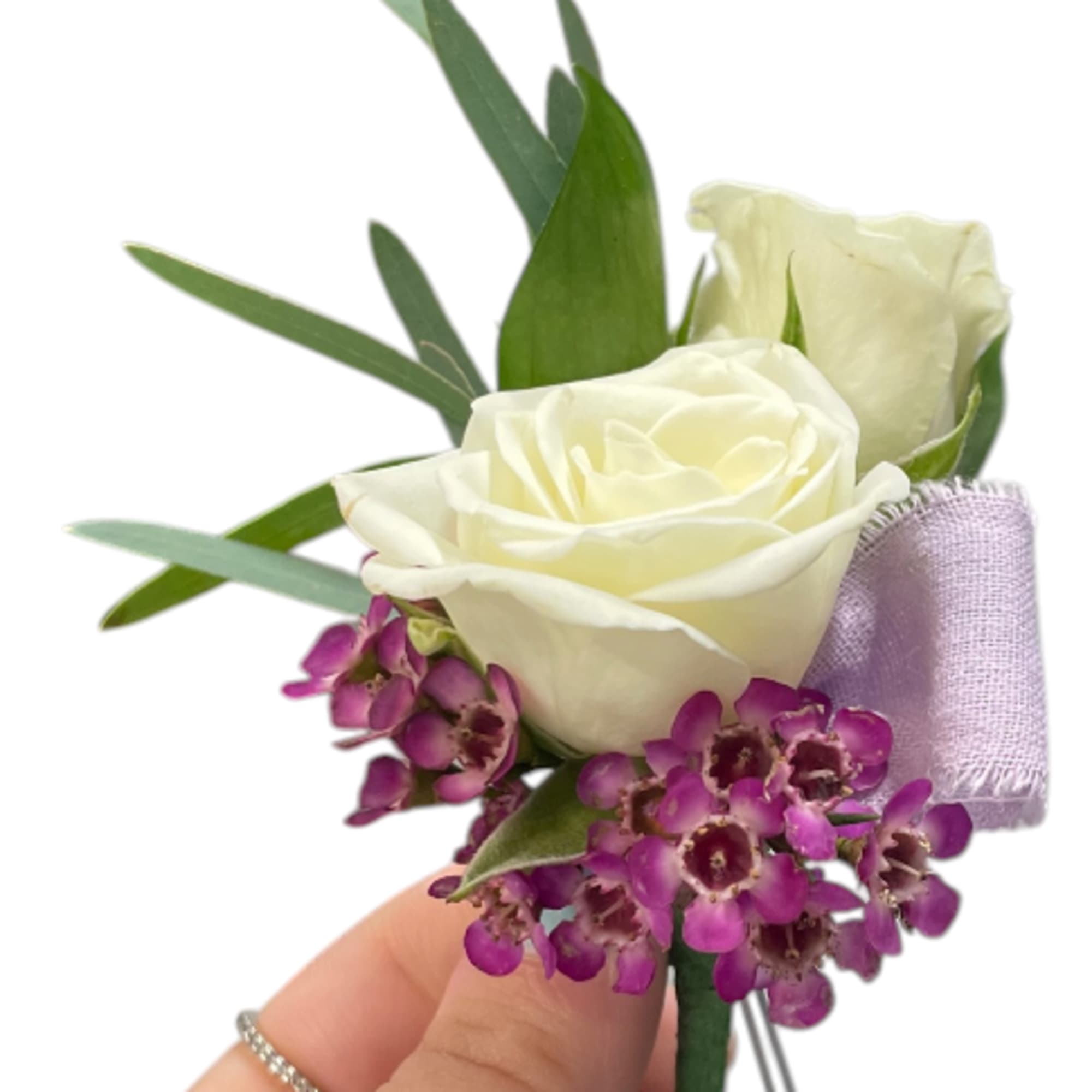 White rose boutonniere with purple accent flowers and ribbon