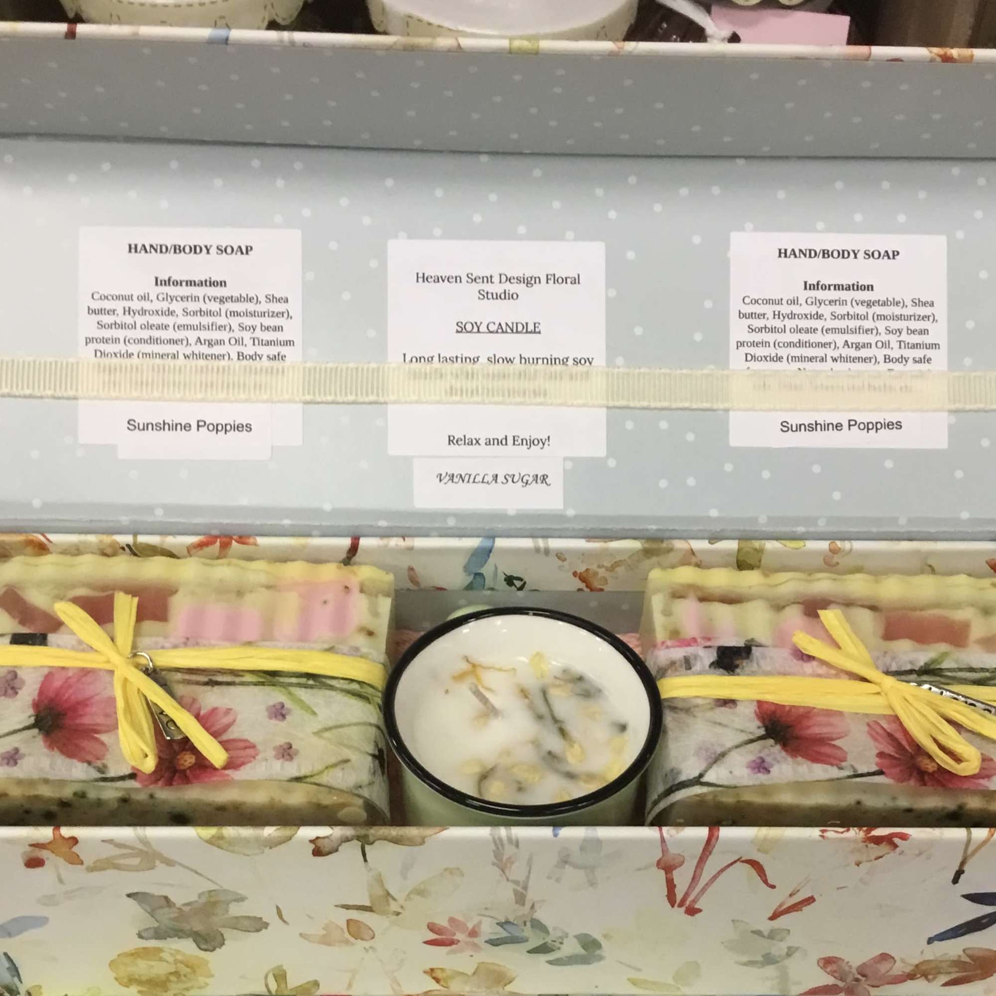 Gift box with floral soap bars and a candle