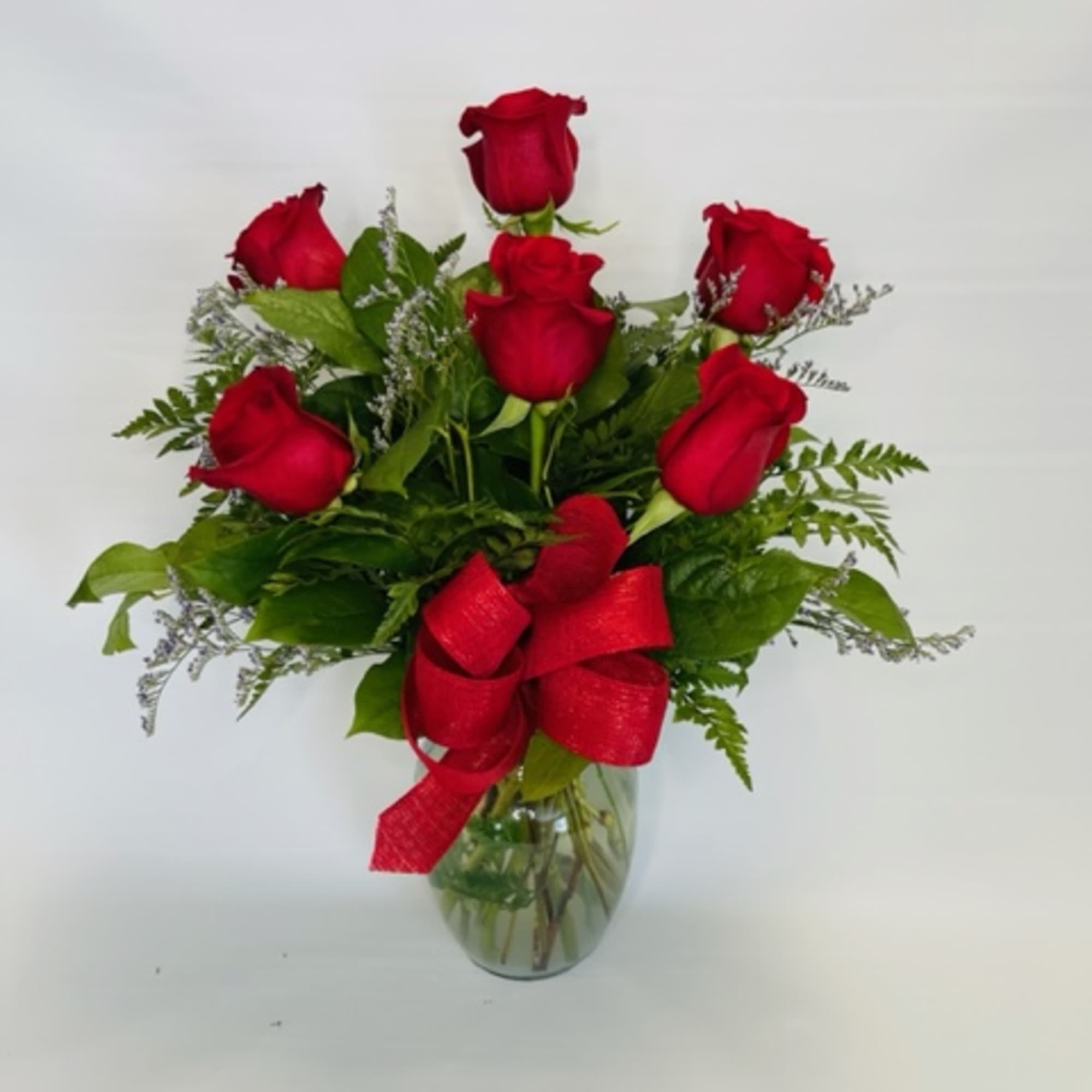 6 Roses arranged in a vase.
