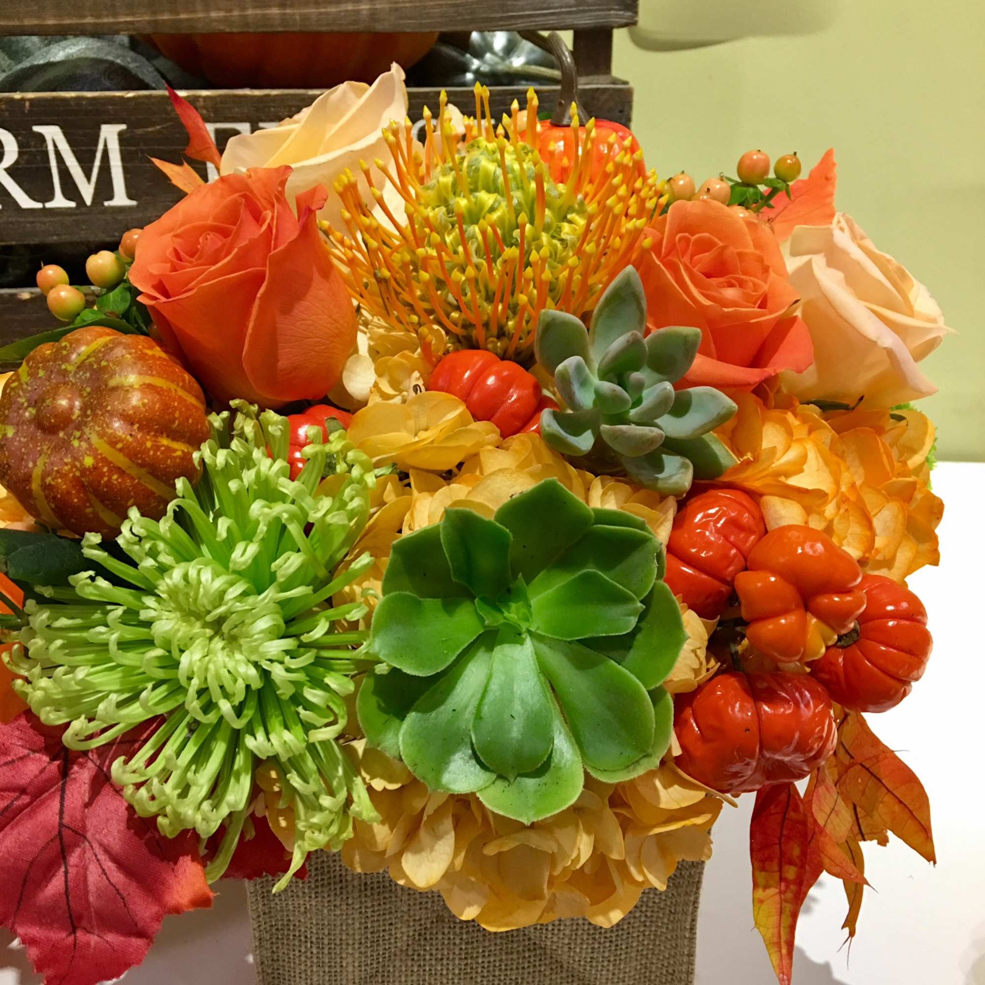 collection of flowers and goods in a custom made vase ,makes a, photo 2 of 3