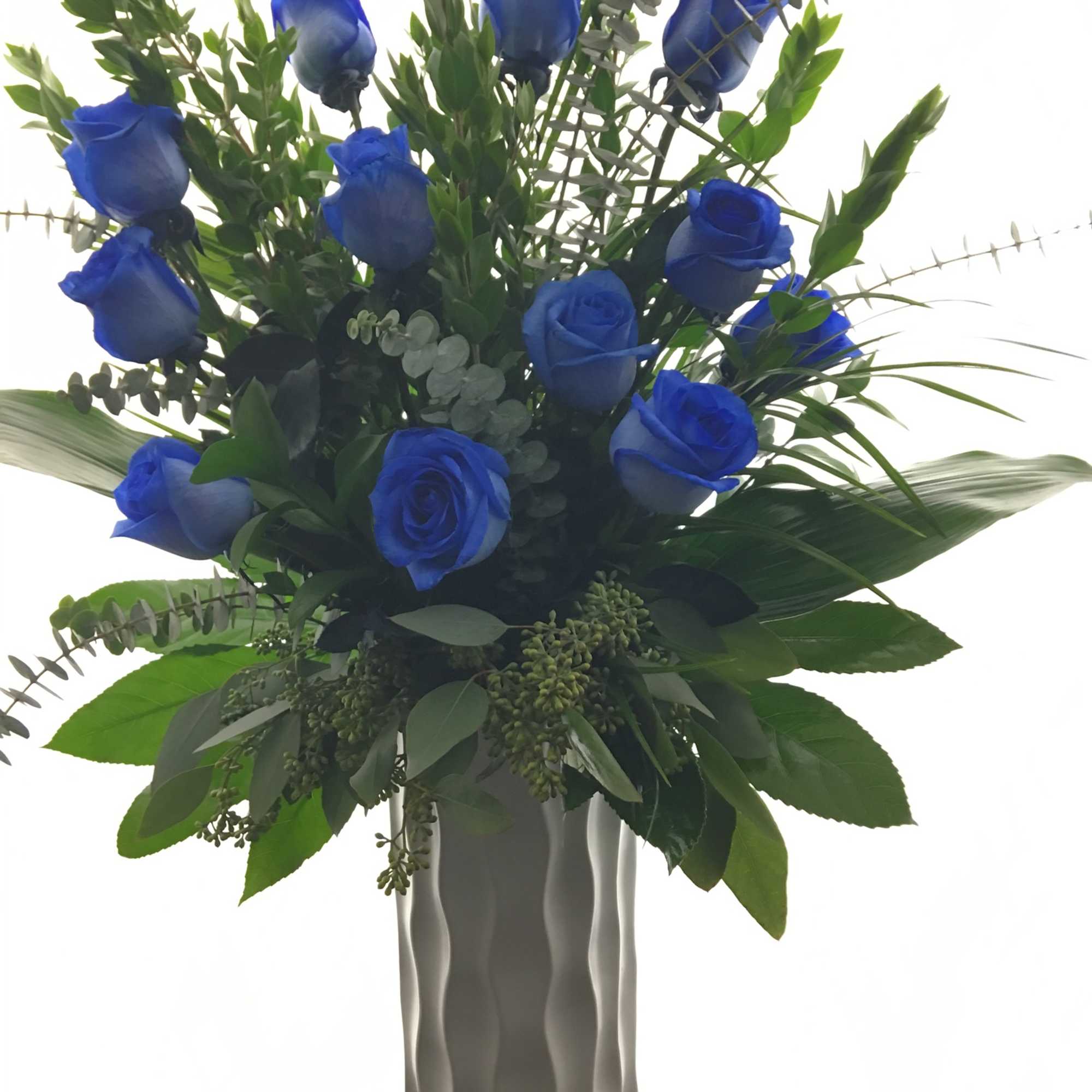 Blue roses in a tall white vase with mixed greenery, photo 4 of 4