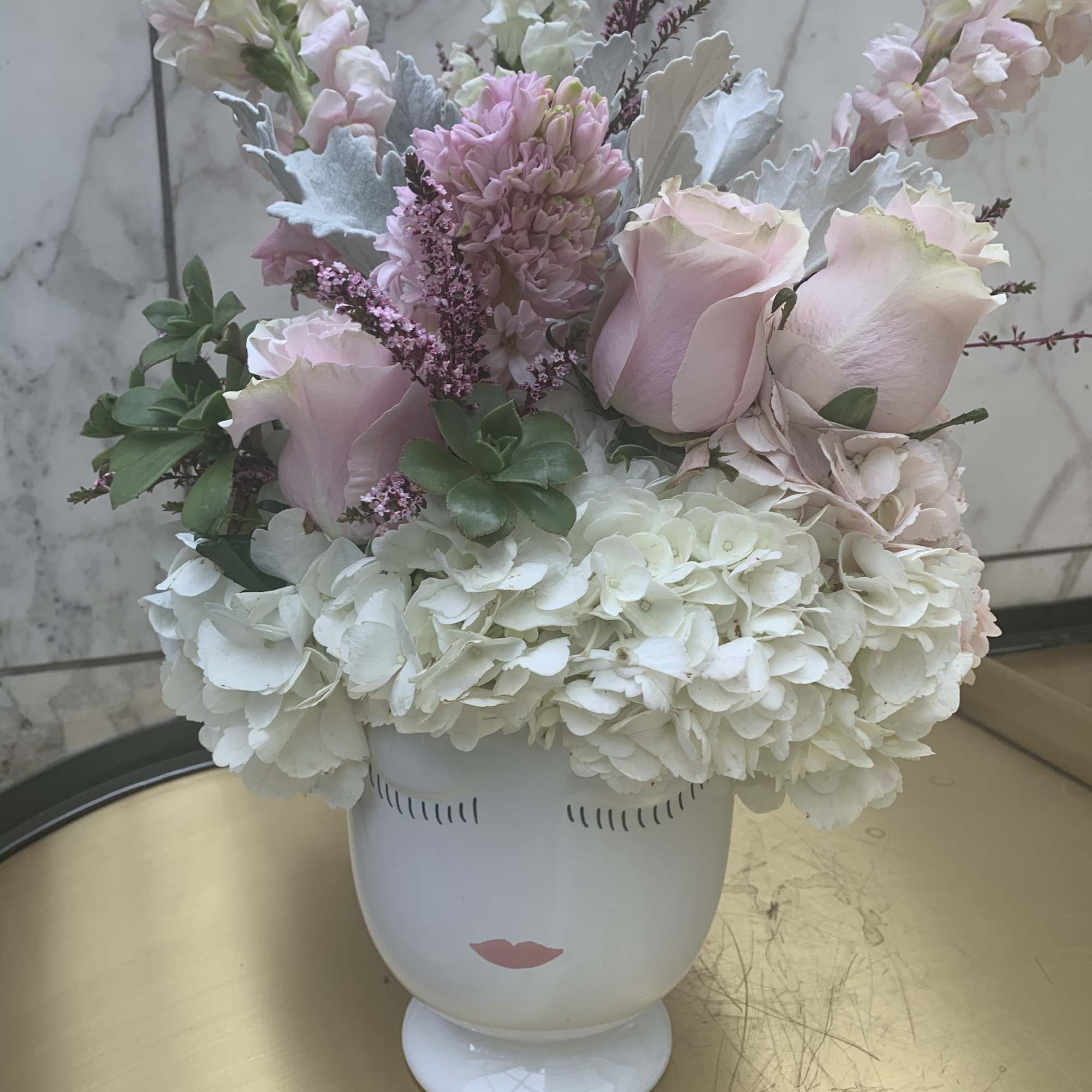 Pink roses and white hydrangeas in a white face vase, photo 6 of 7