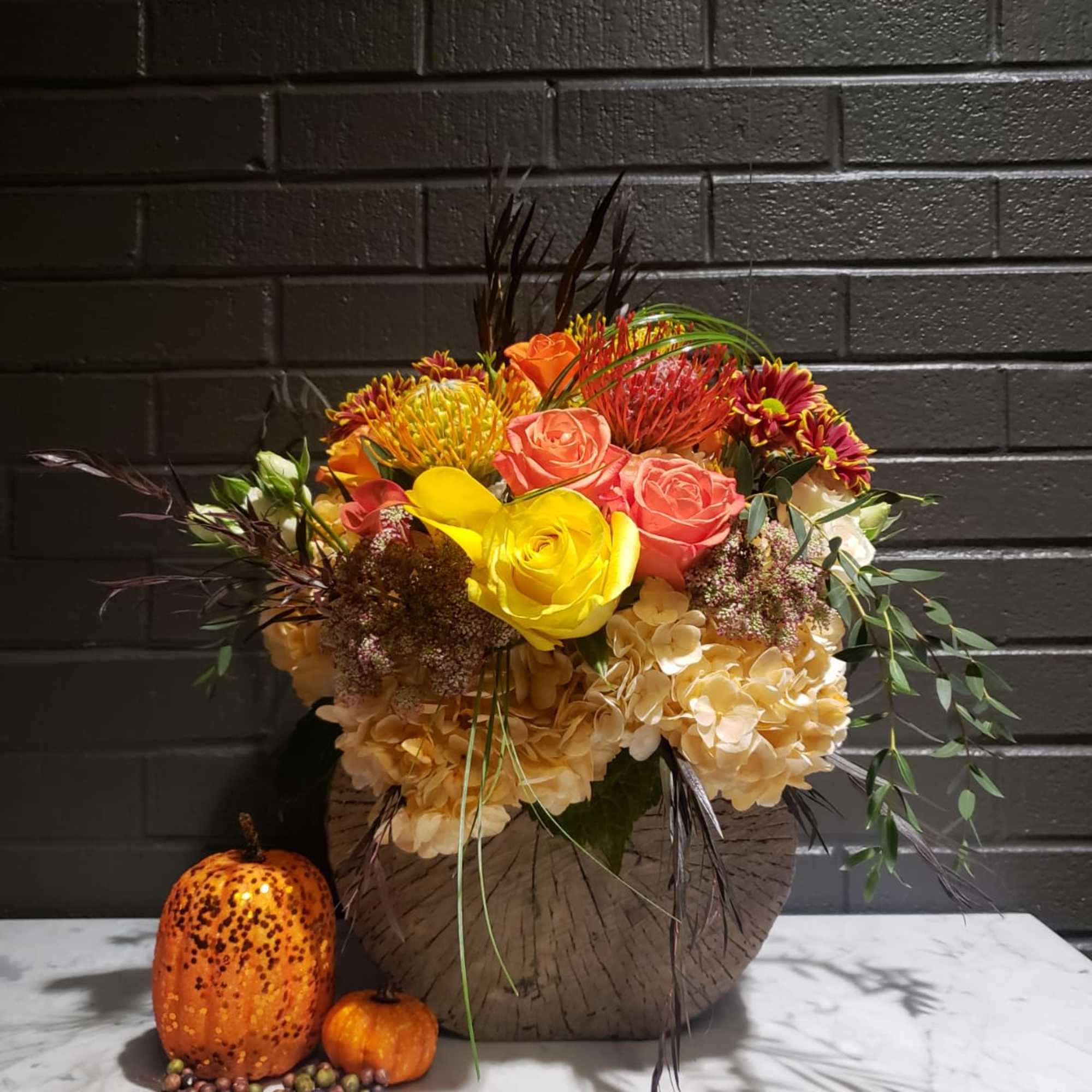 Created in a cement vase fill assorted fall colors flowers make this, photo 2 of 2