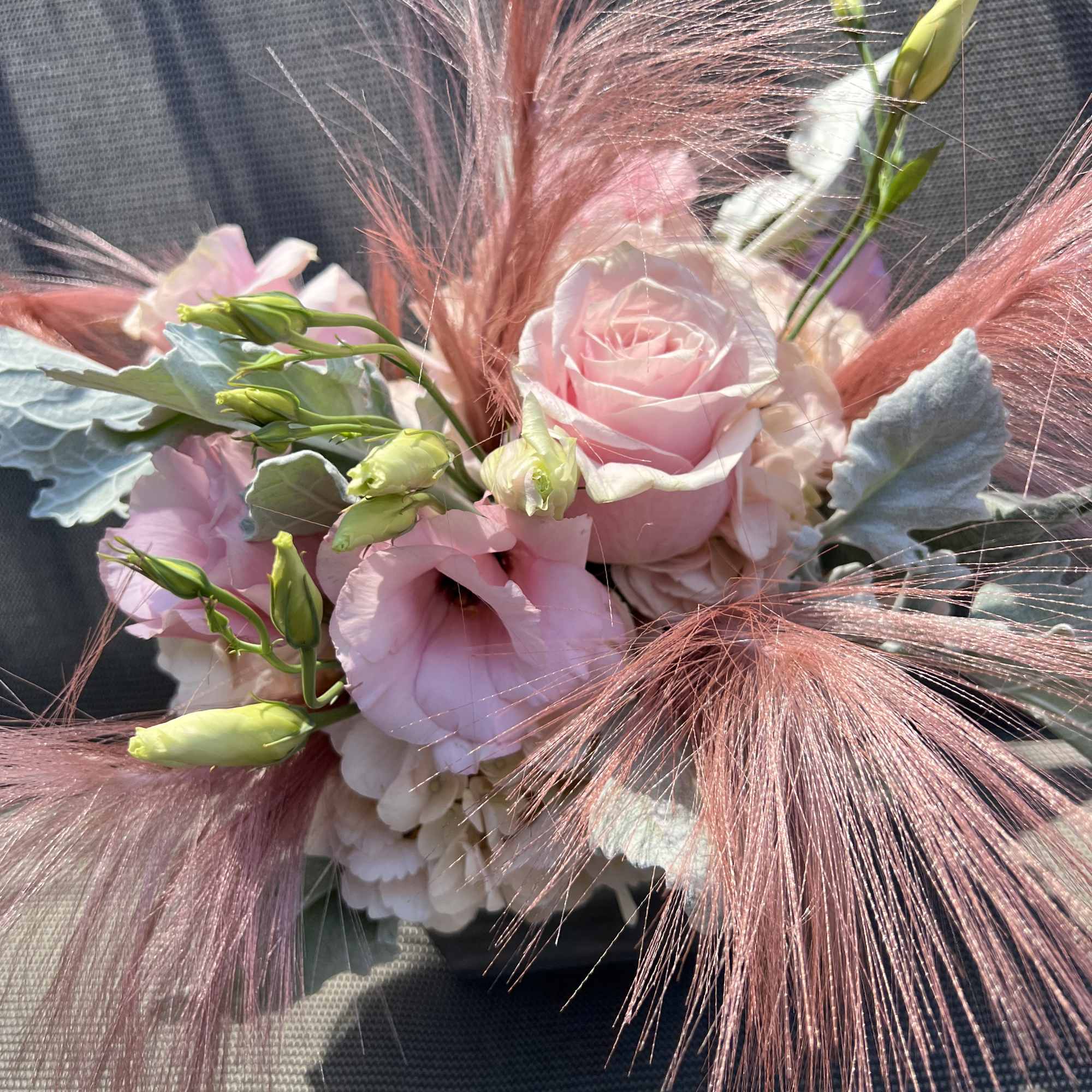 Pink rose and lisianthus bouquet with feathery pink accents