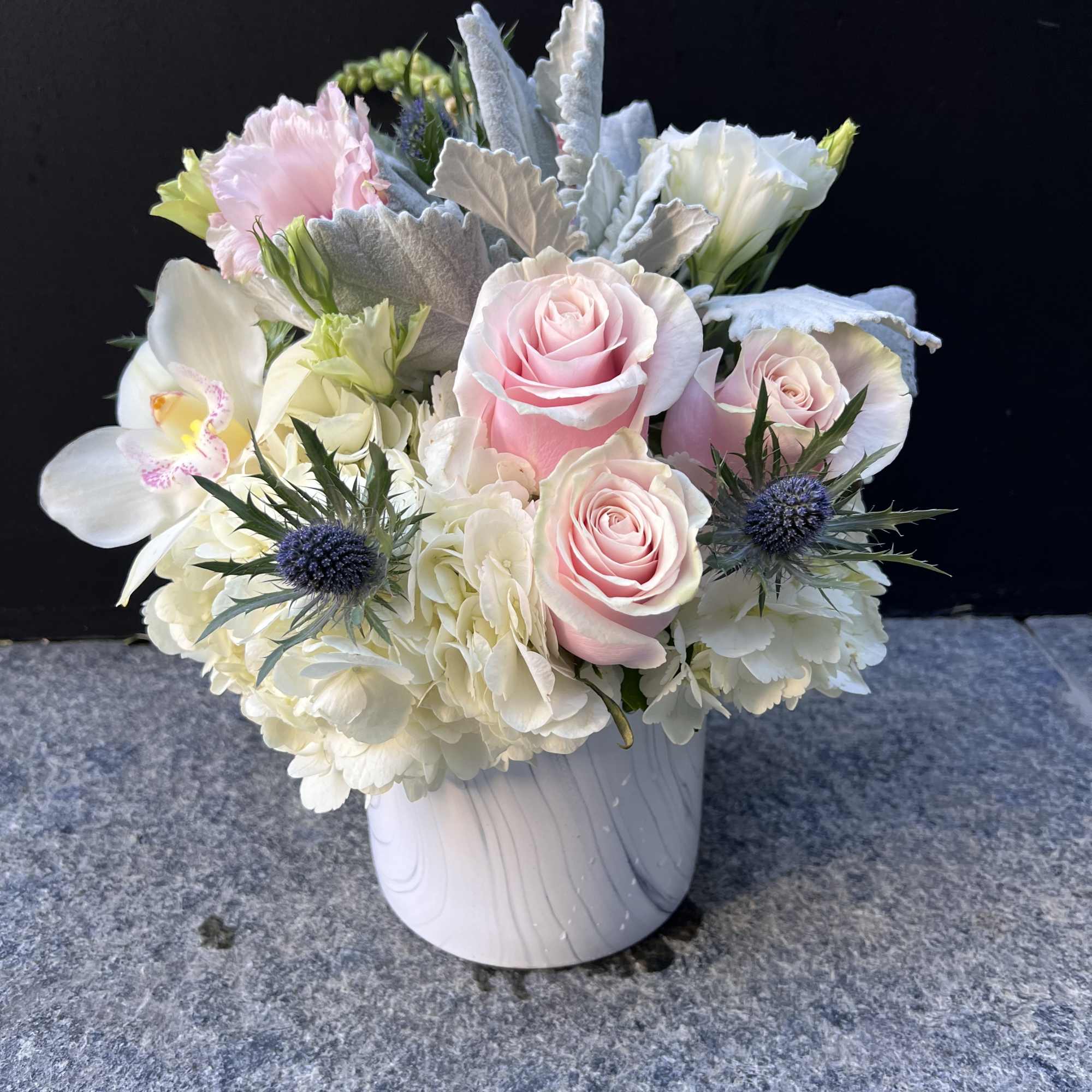 Pink roses and white orchids in a white vase, photo 3 of 4