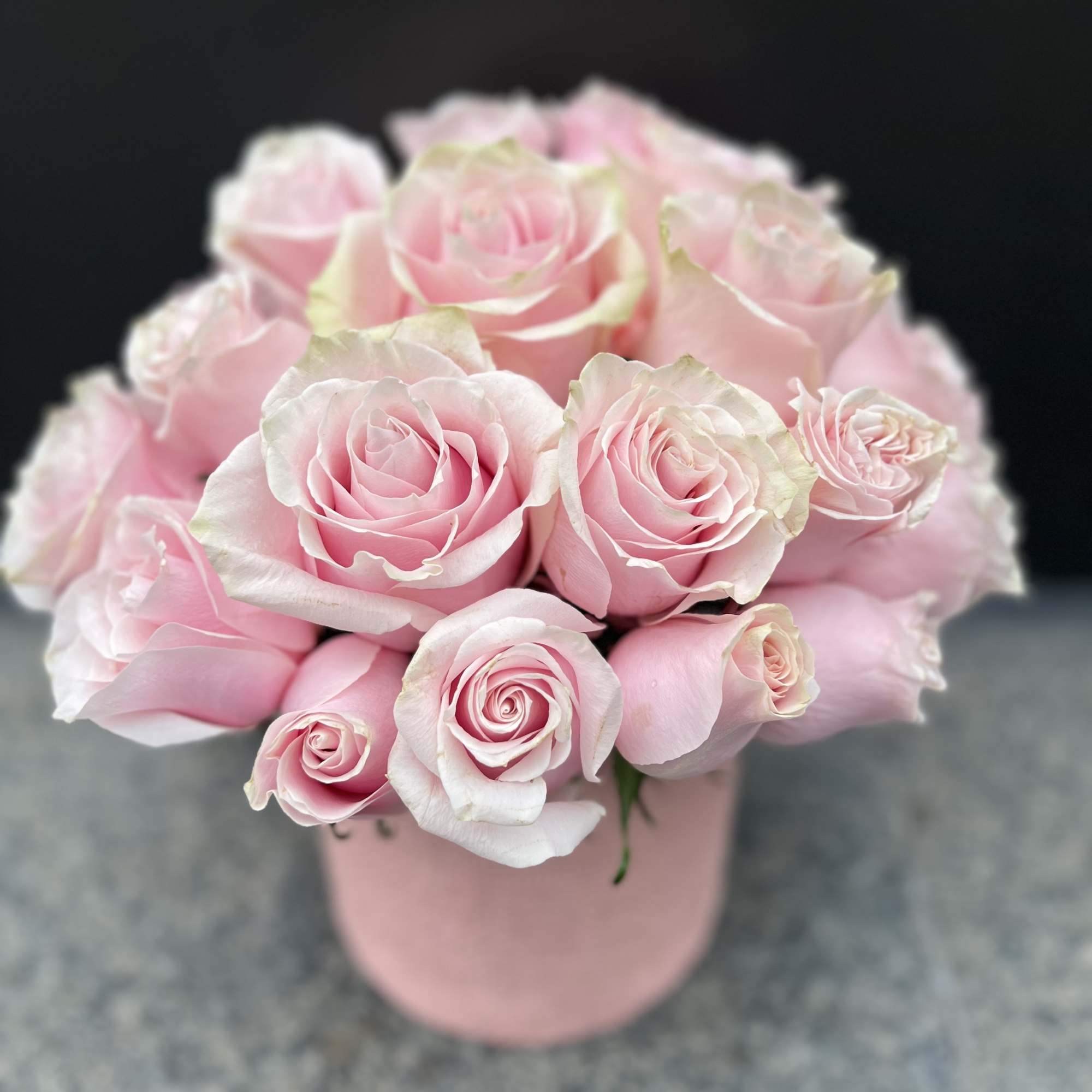 Bouquet of pale pink roses in a pink box