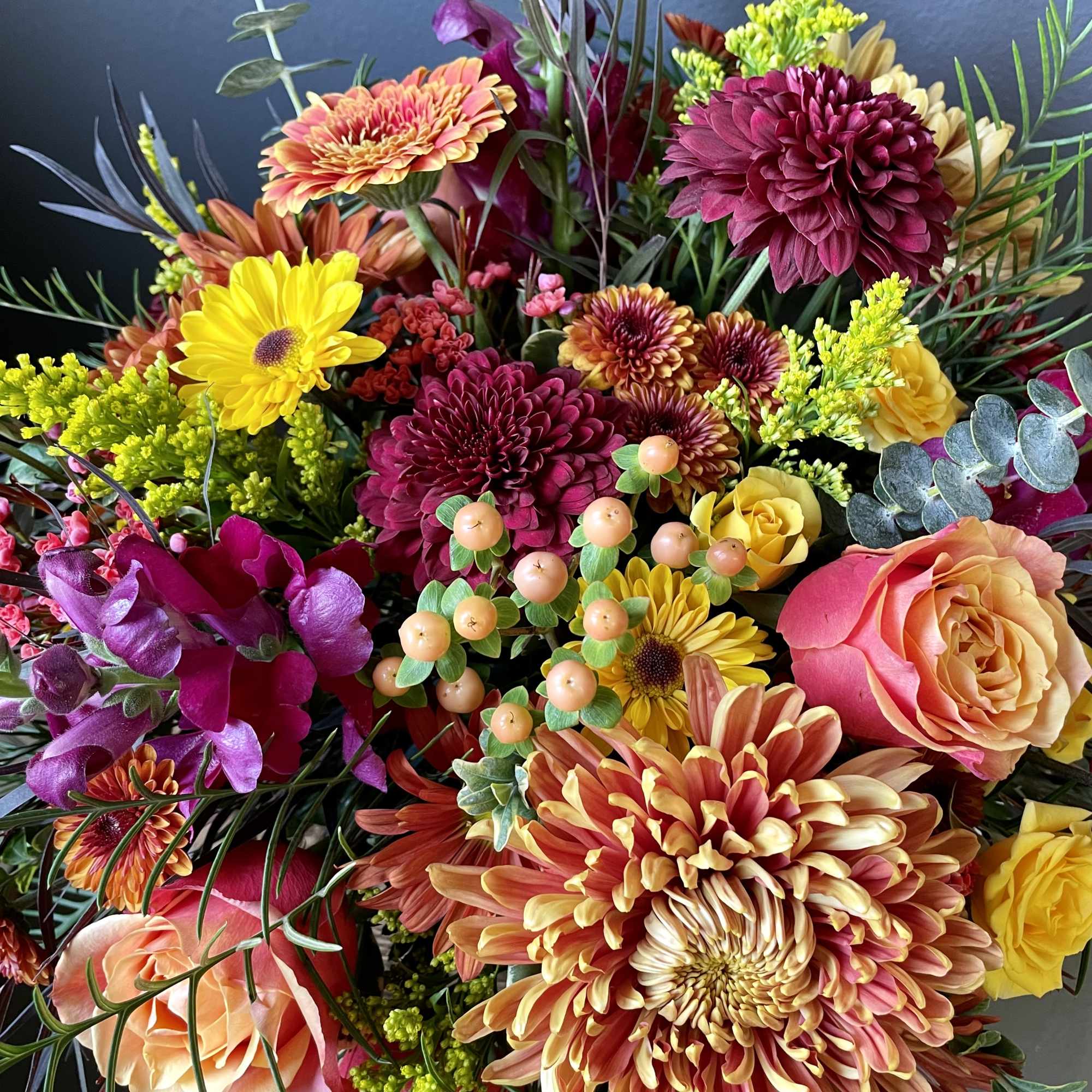 A lush seasonal centerpiece perfect for all your fall gatherings. This centerpiece, photo 2 of 3