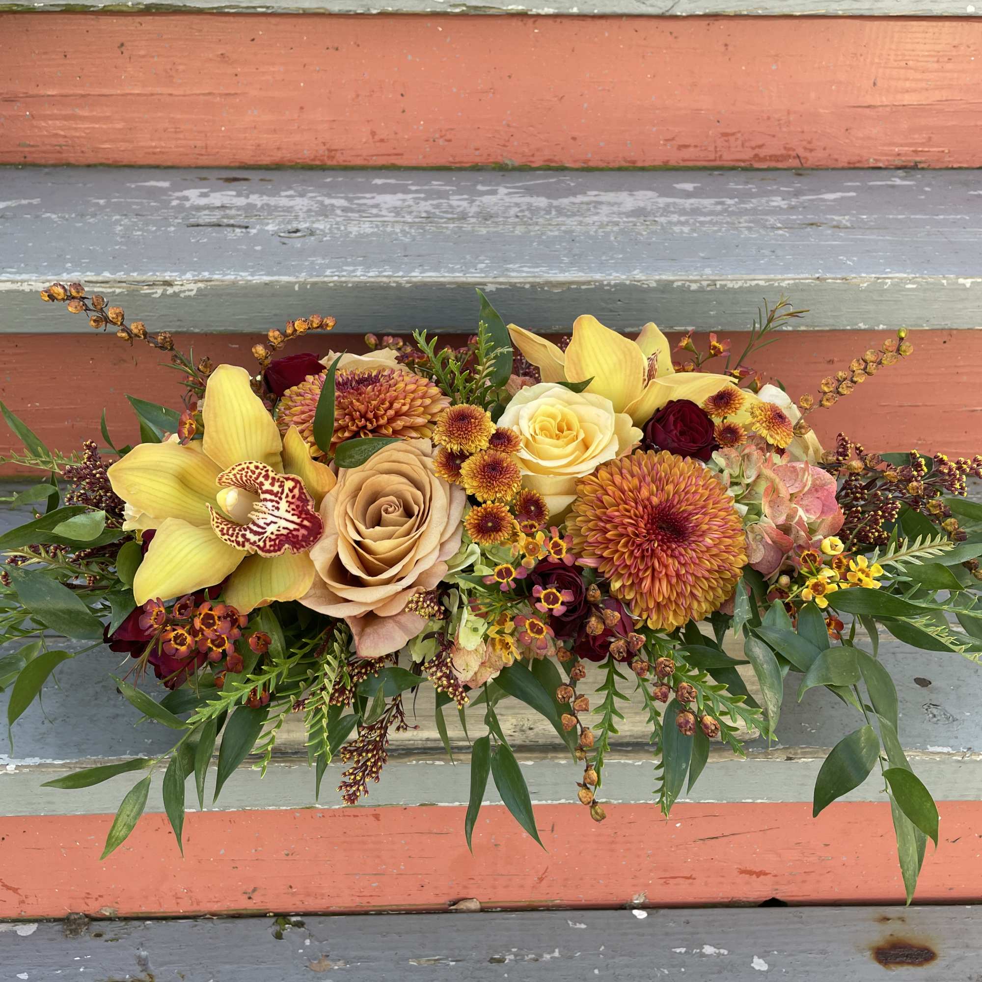 Mixed bouquet with yellow orchids, roses, and chrysanthemums