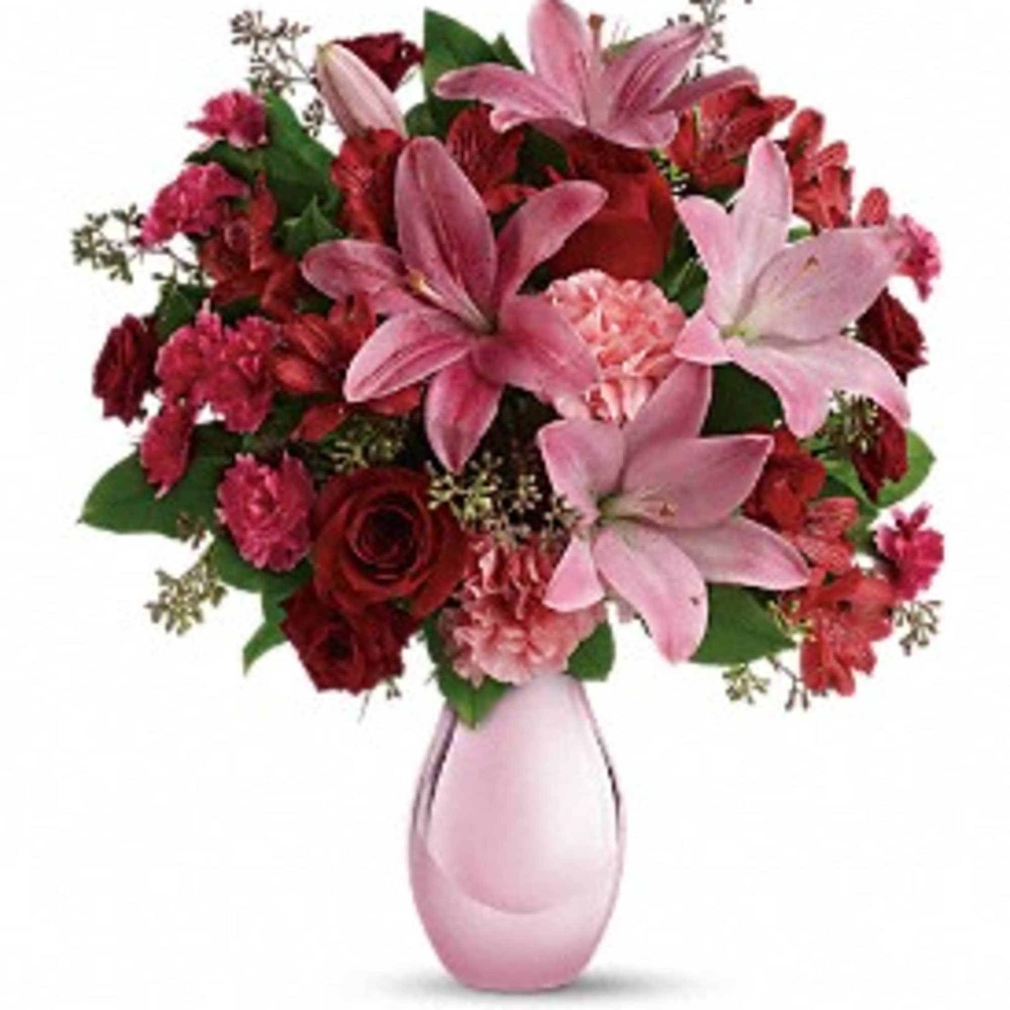 Pink lilies and red roses in a pink vase