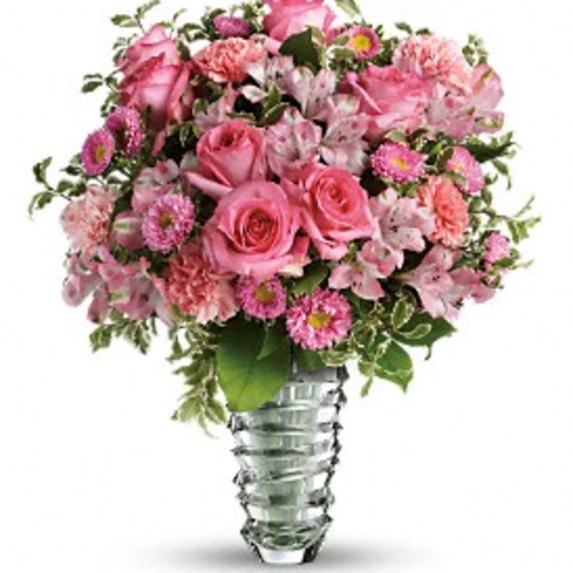 Pink rose and mixed flower bouquet in a clear glass vase