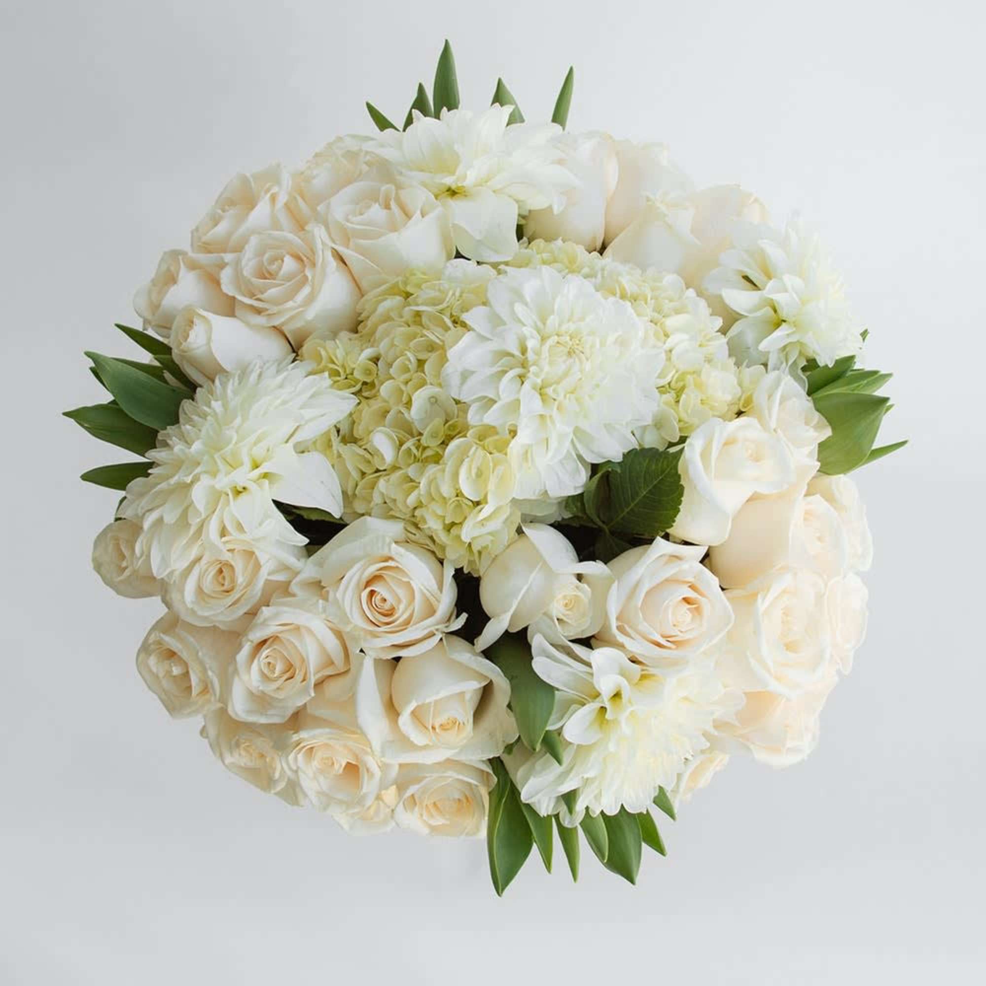 Cream rose and white chrysanthemum bouquet with green leaves