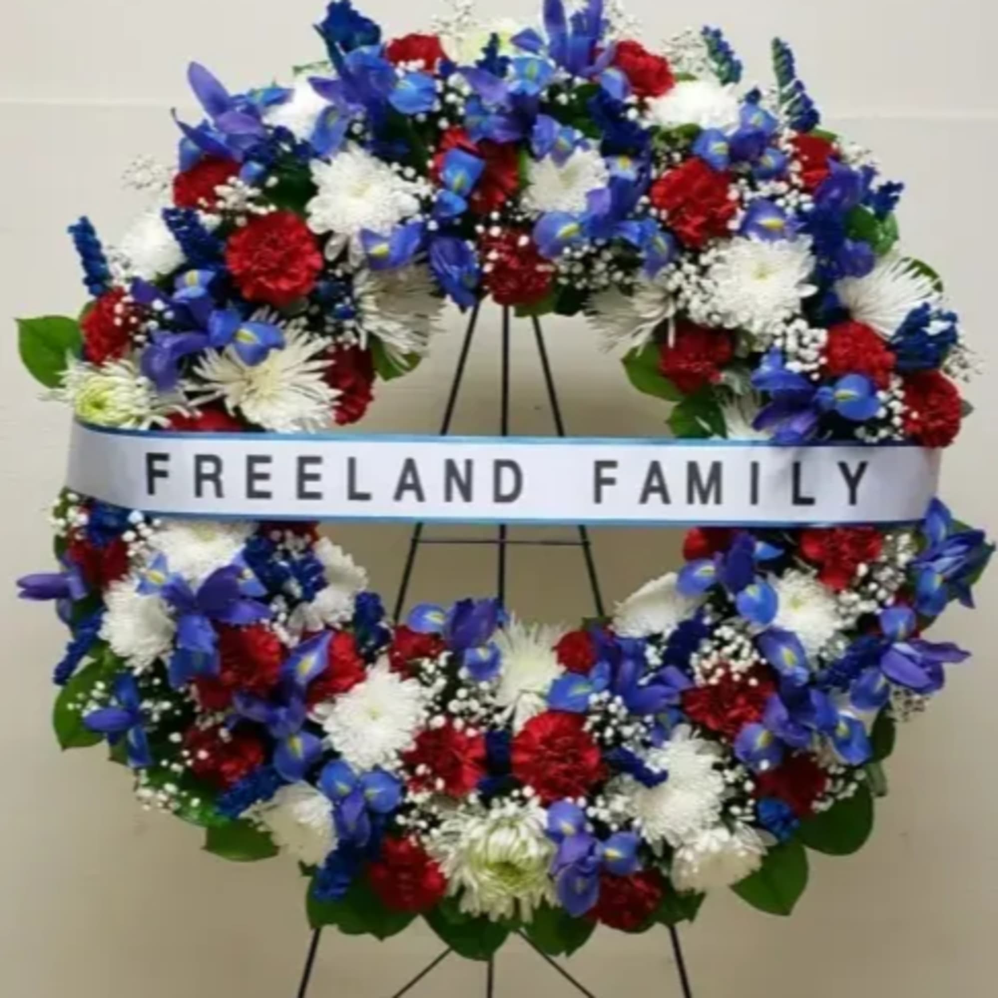 36" PREMIUM HOPE AND HONOR WREATH WITH IRISES AND HORIZONTAL PRINTED BANNER
