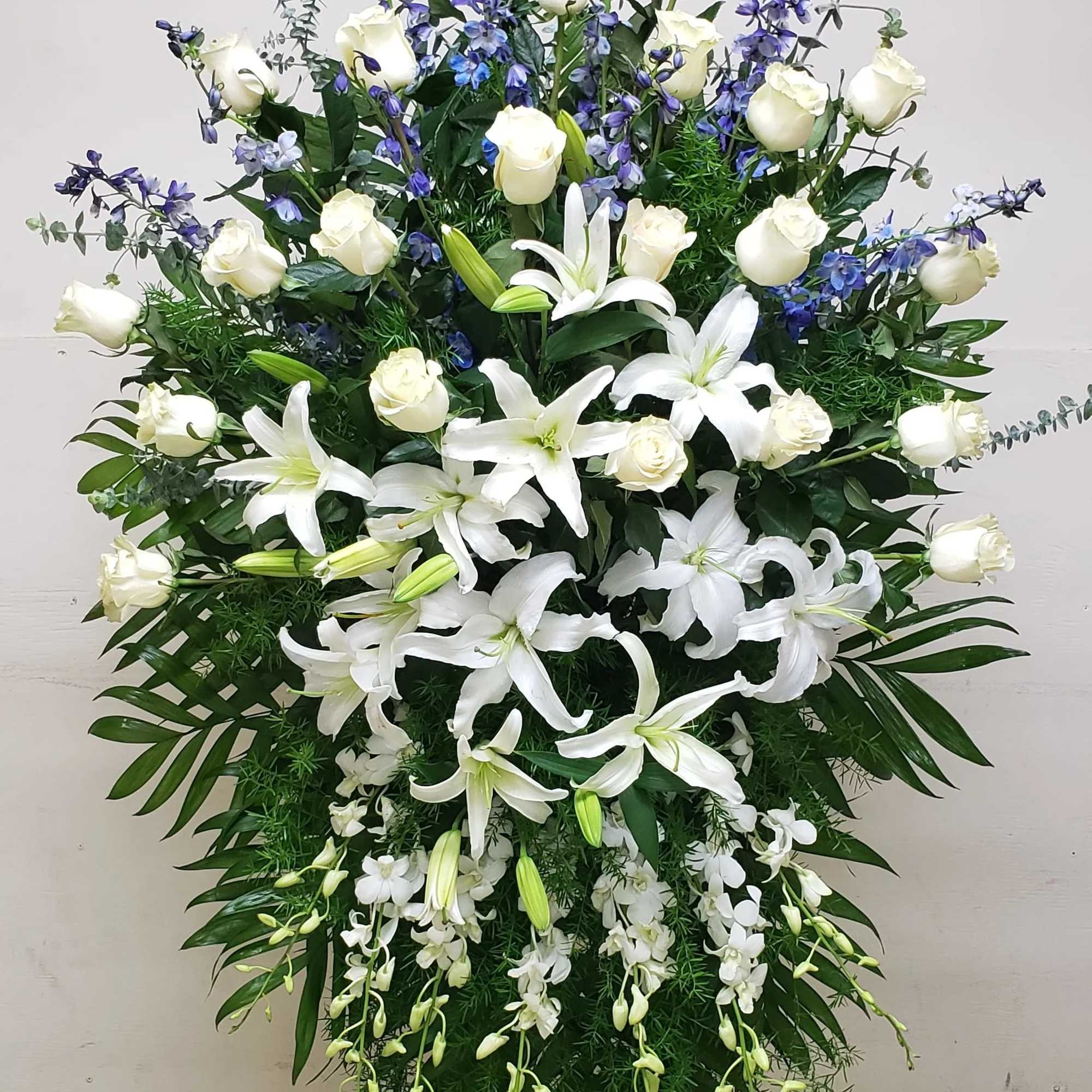 CLEAR BLUE SKIES STANDING SPRAY BY TWIN TOWERS FLORIST IN ARLINGTON, VA