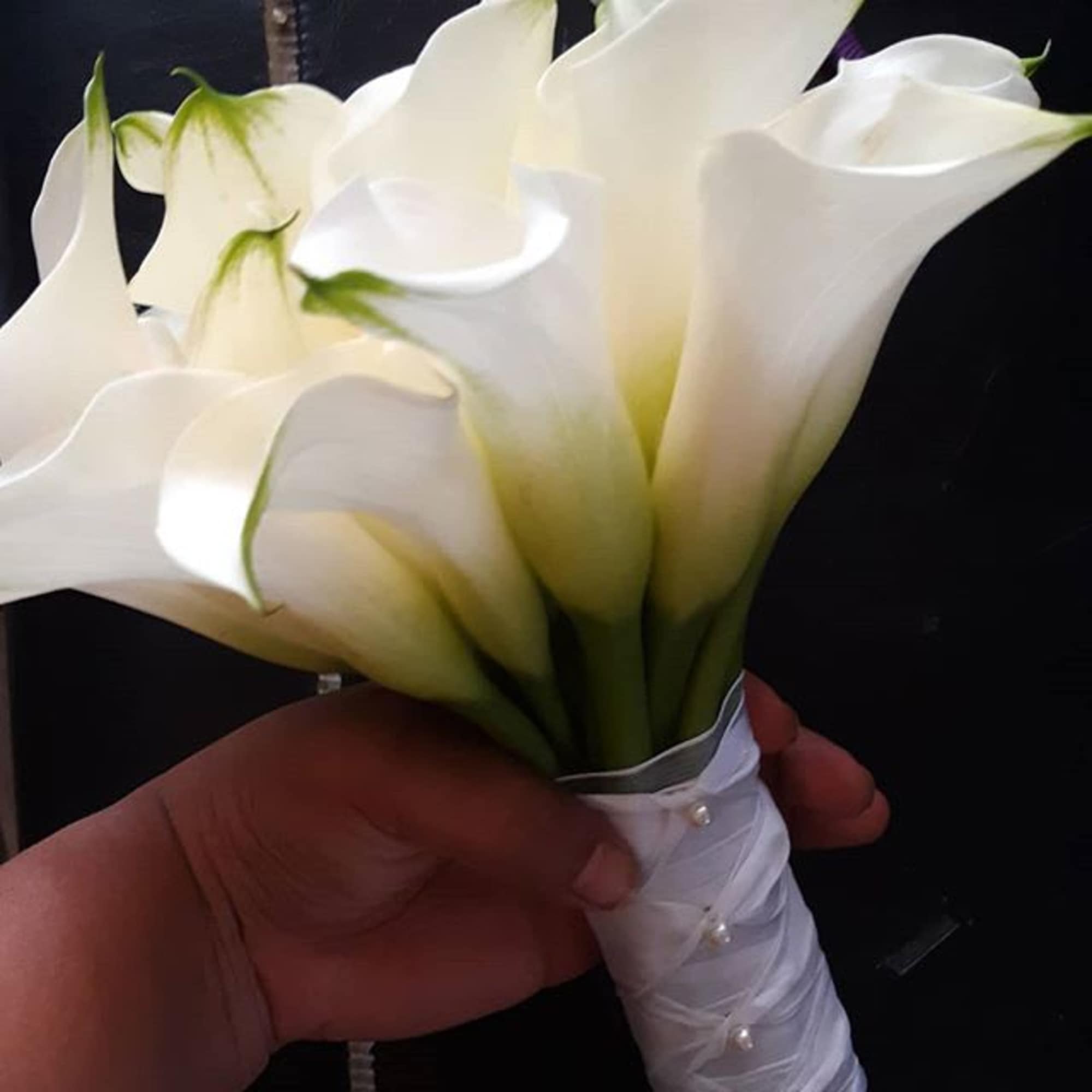 White calla lily bouquet with a wrapped handle