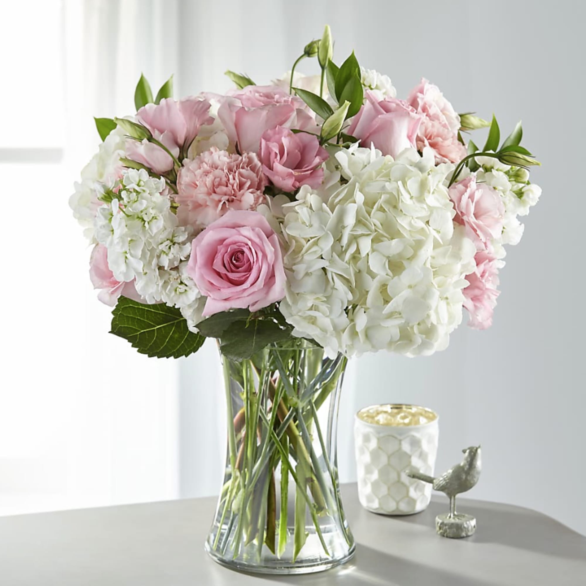 Blush Hydrangea Dream is a soft and elegant arrangement featuring lush white