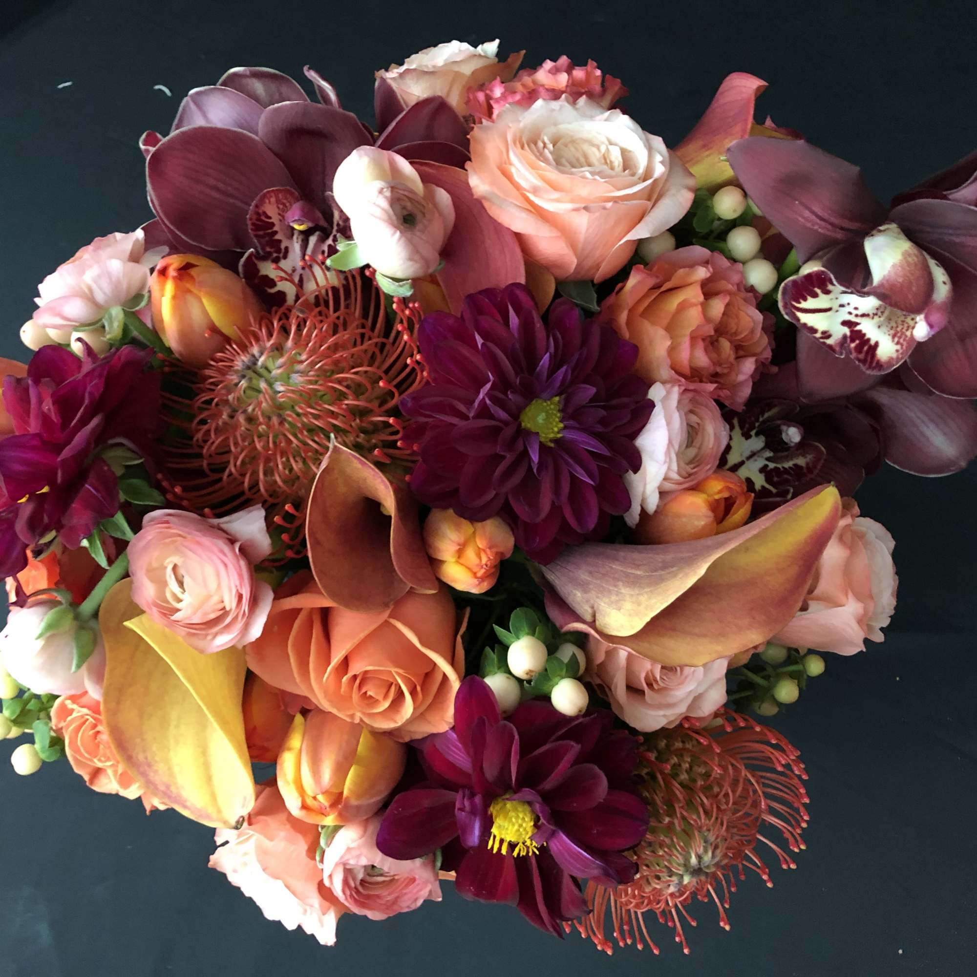 Mixed bouquet with roses, orchids, calla lilies, and chrysanthemums