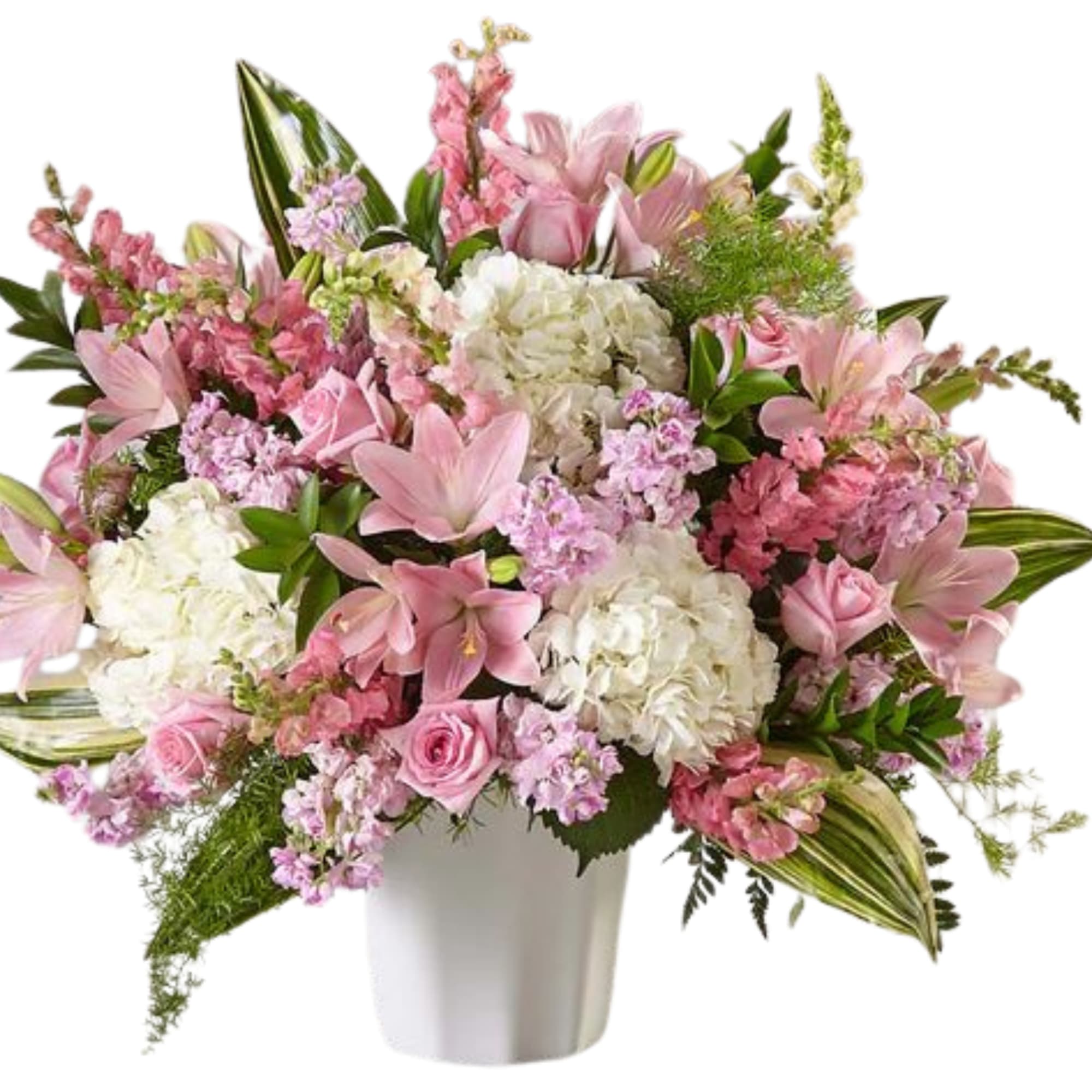 Pink and white mixed flower arrangement in a white vase