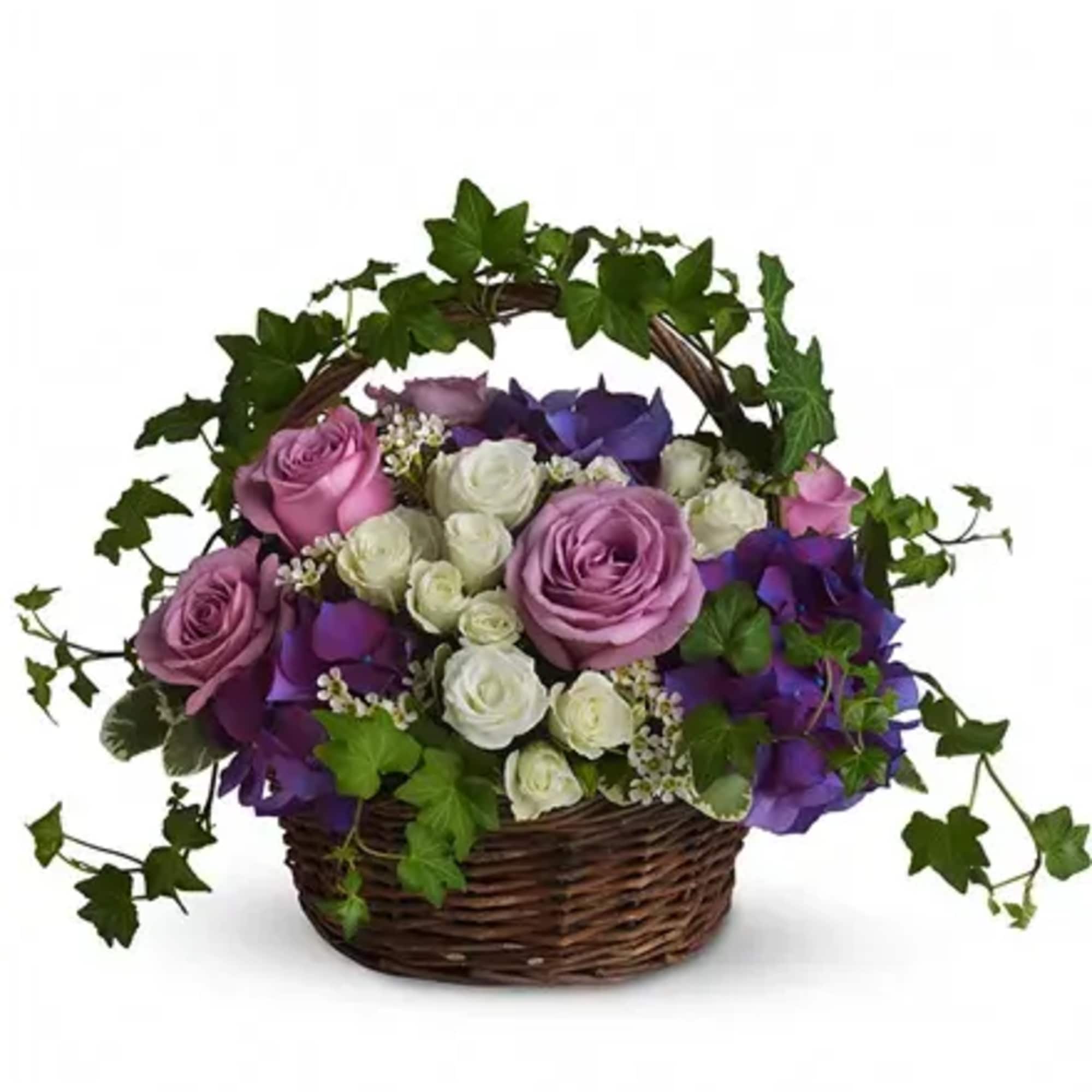 Basket of pink, white, and purple roses with ivy