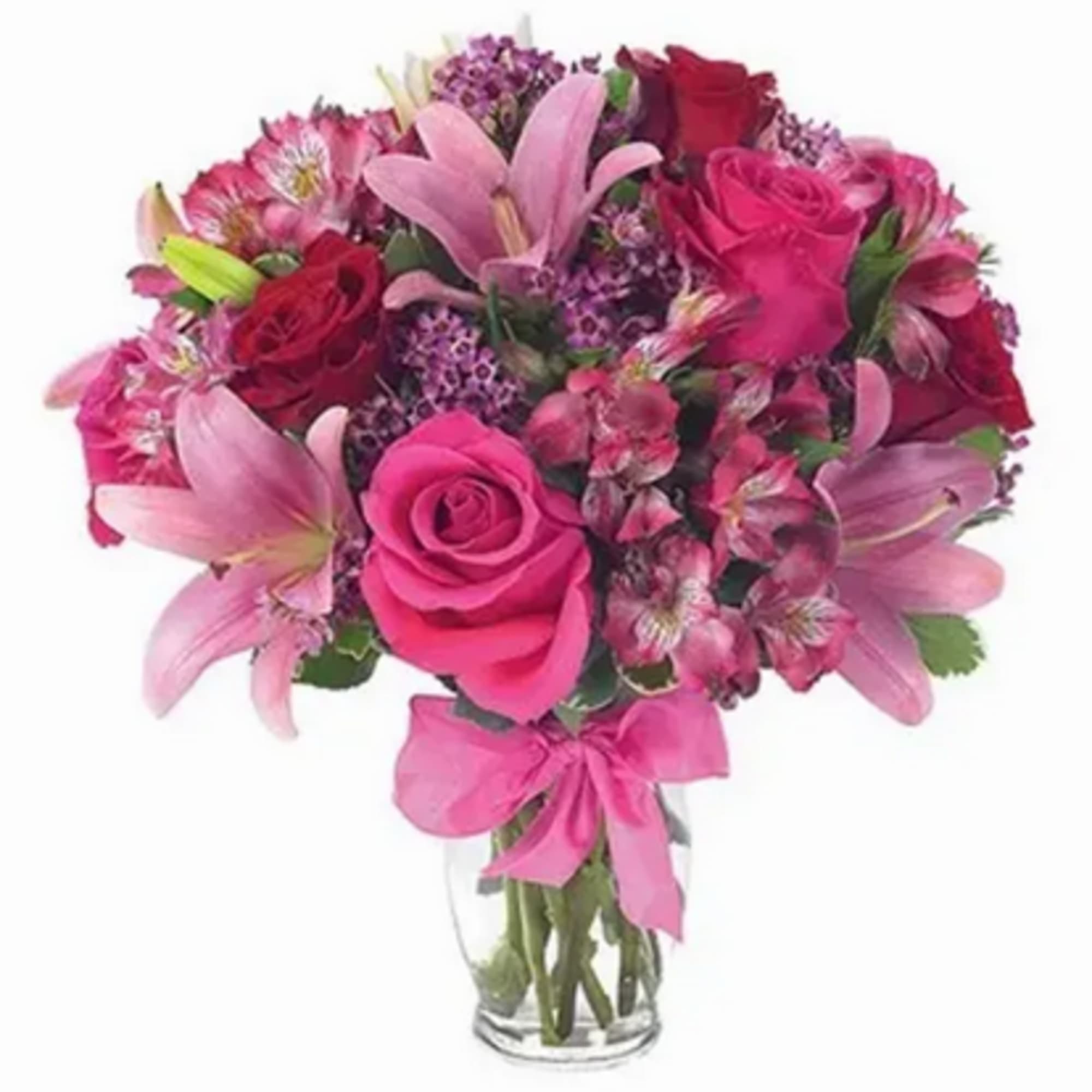 This flirtatious combination of Asiatic lilies, waxflower, alstroemeria and roses makes a