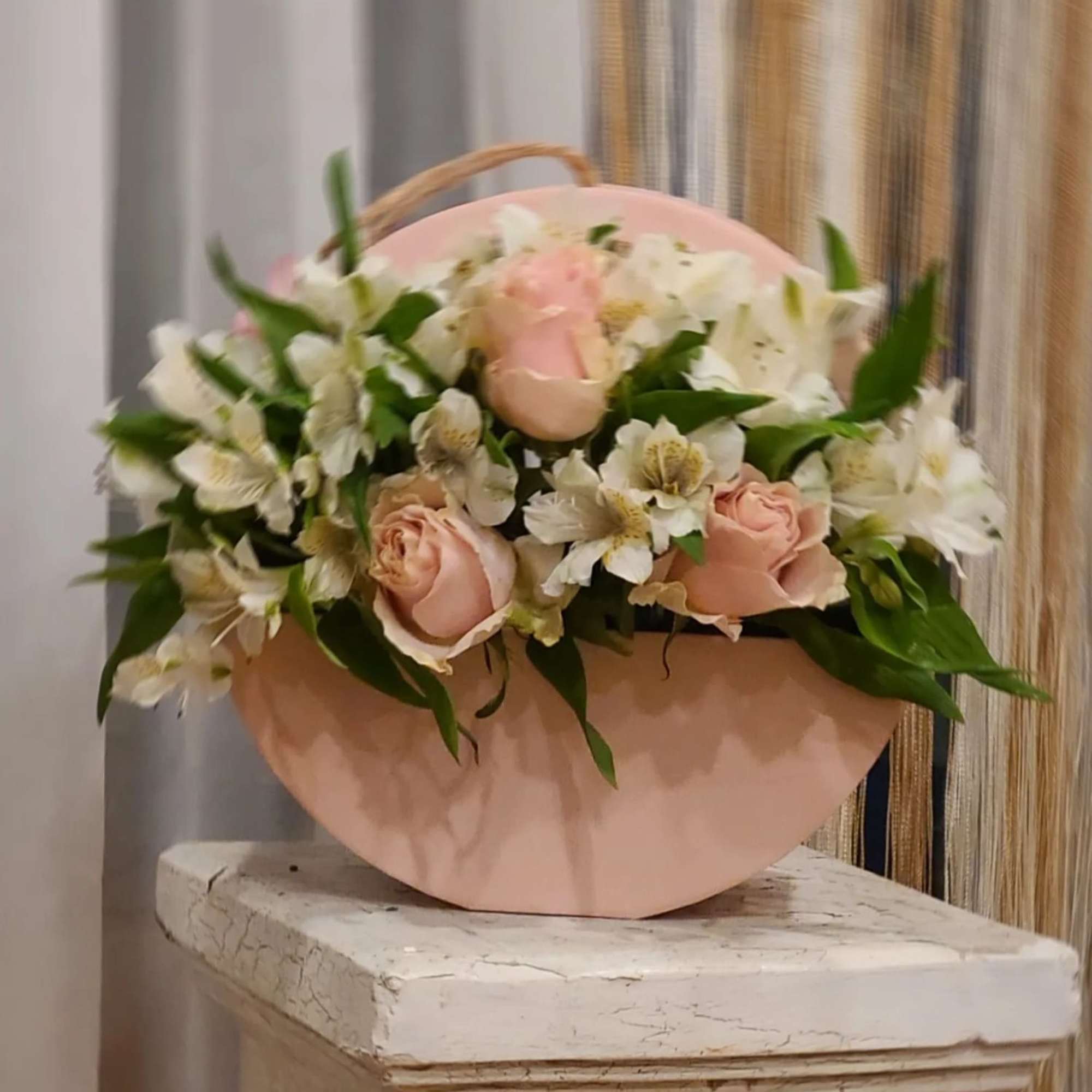 Pink roses and white flowers in a blush paper wrap
