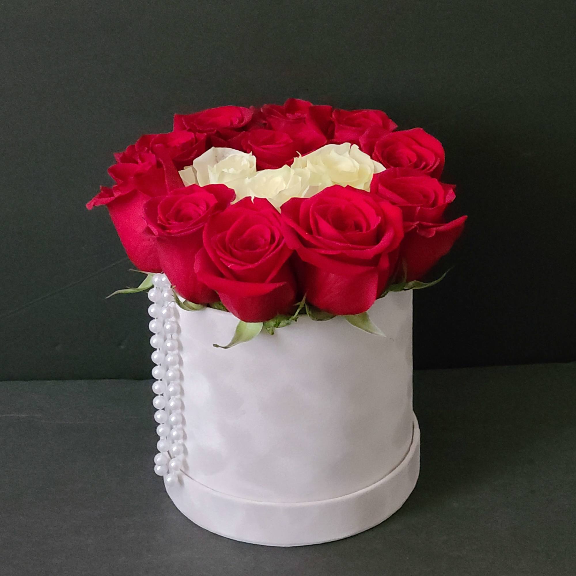 Red and white roses arranged in a white hat box with pearl trim, photo 2 of 3