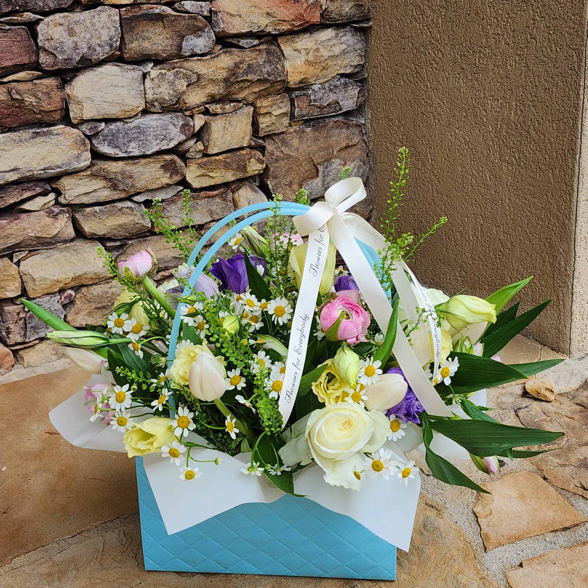 Mixed bouquet in a blue gift box with white ribbon
