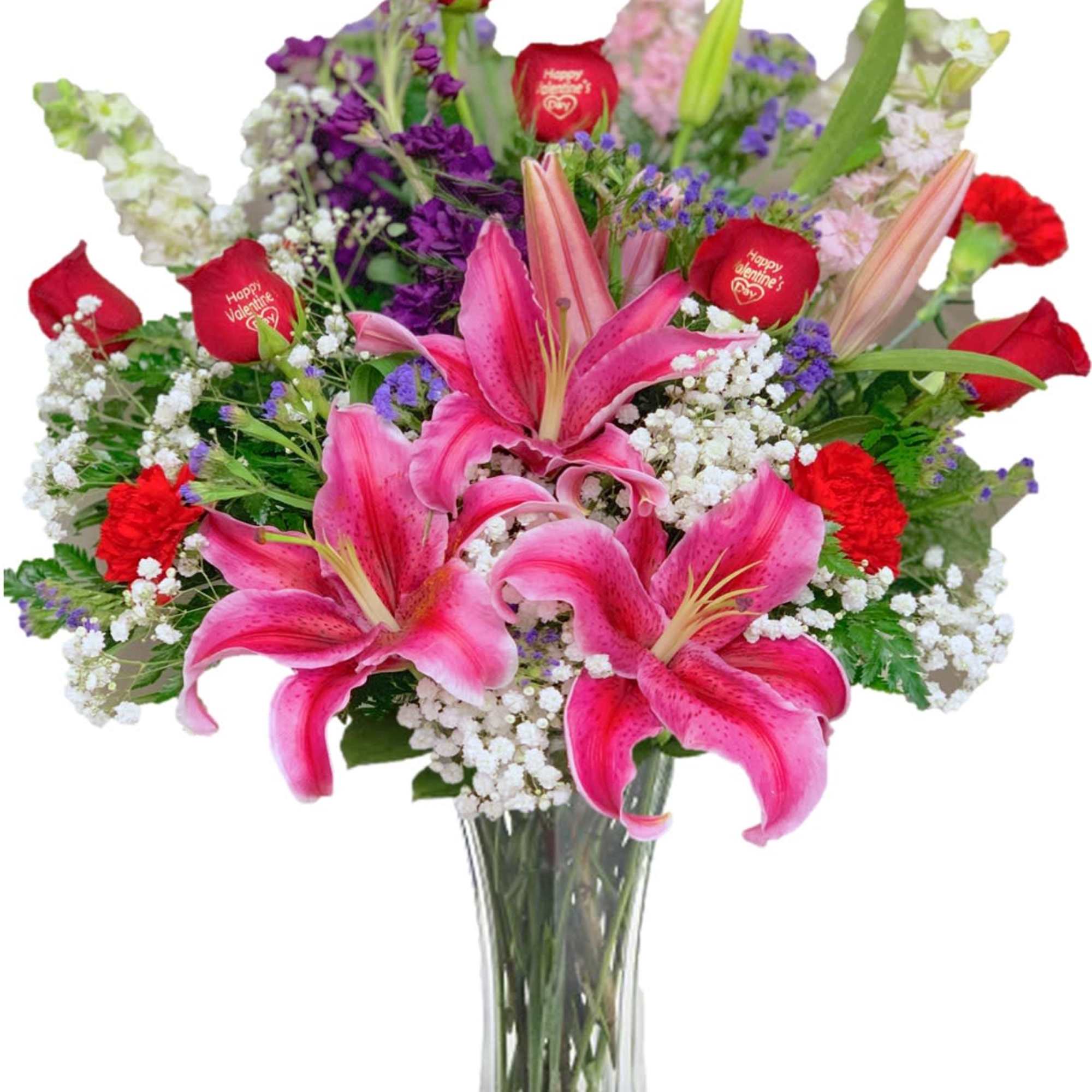 Pink lilies and red roses in a clear glass vase