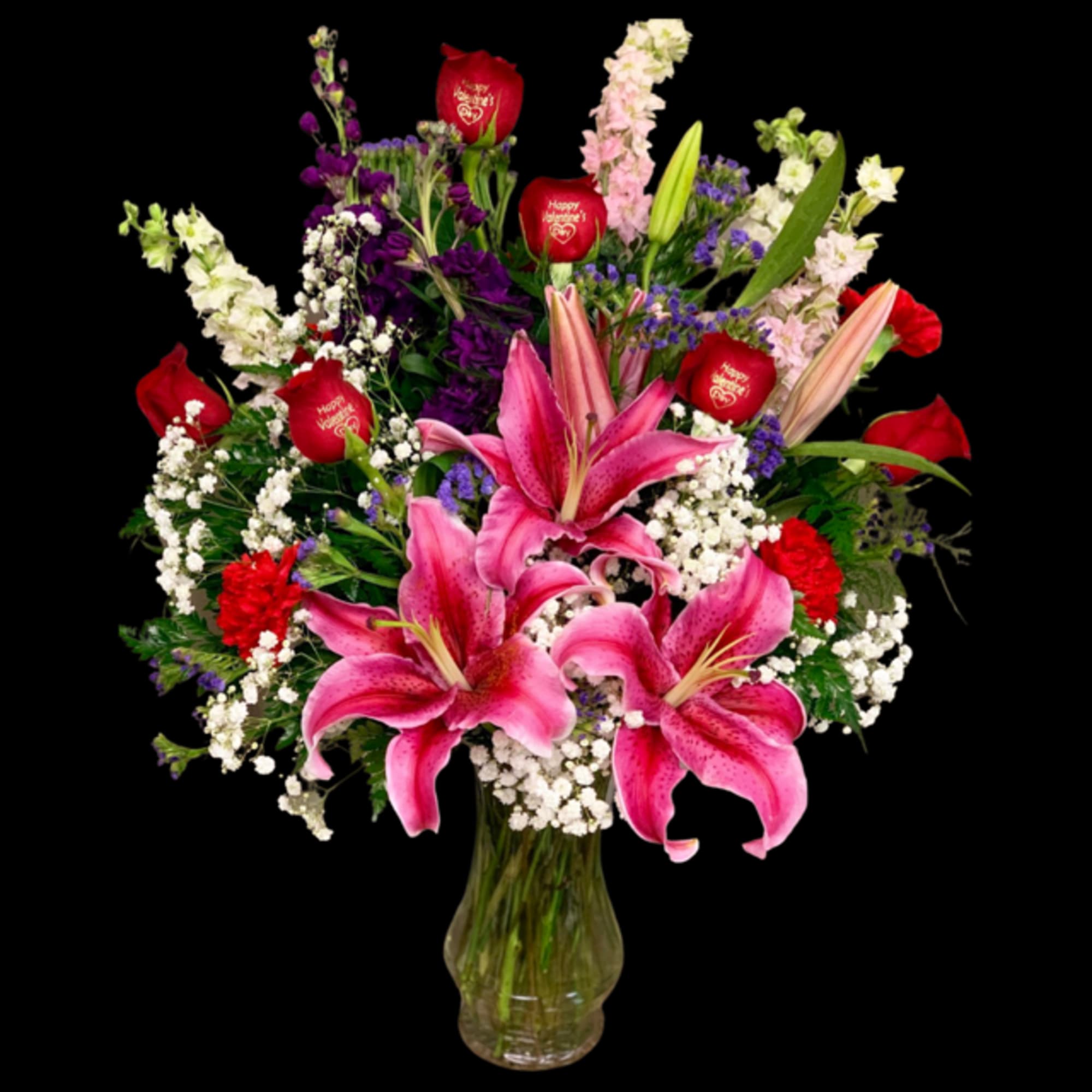 Pink lilies and red roses in a glass vase