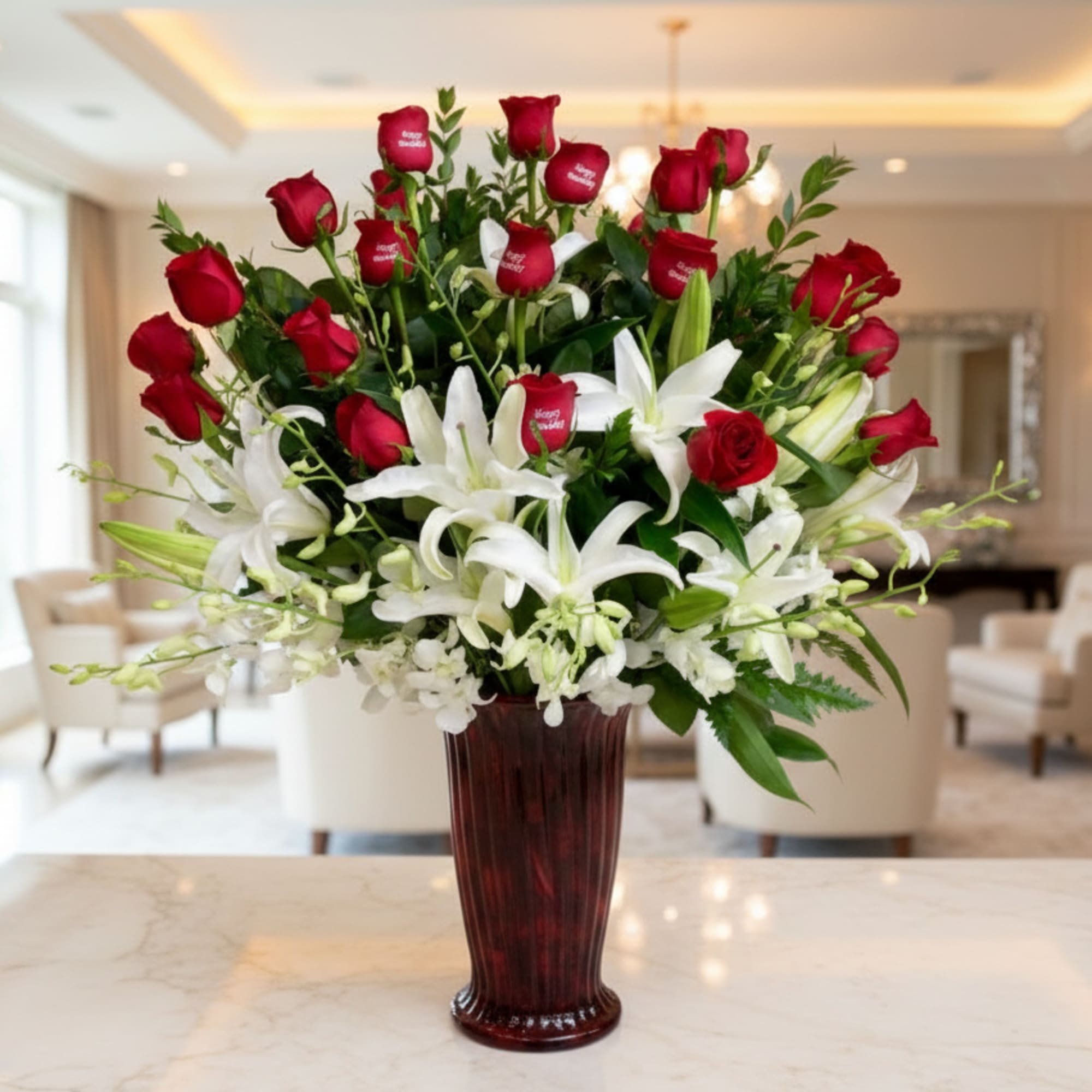 Red roses and white lilies arranged in a tall vase