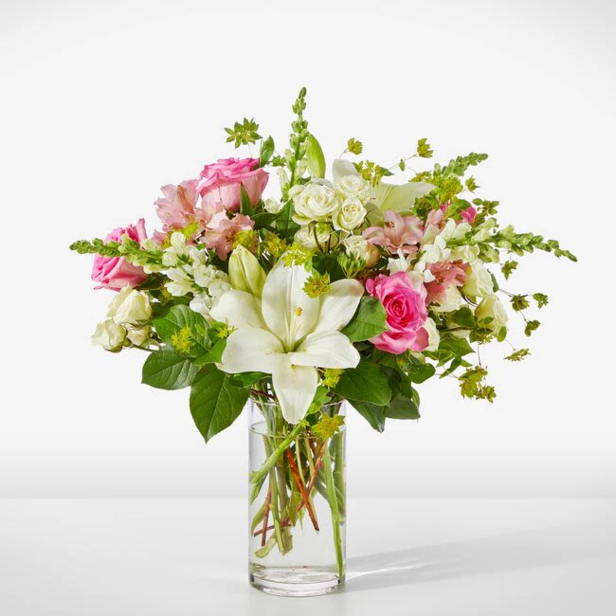 Pink and white mixed bouquet in a clear glass vase