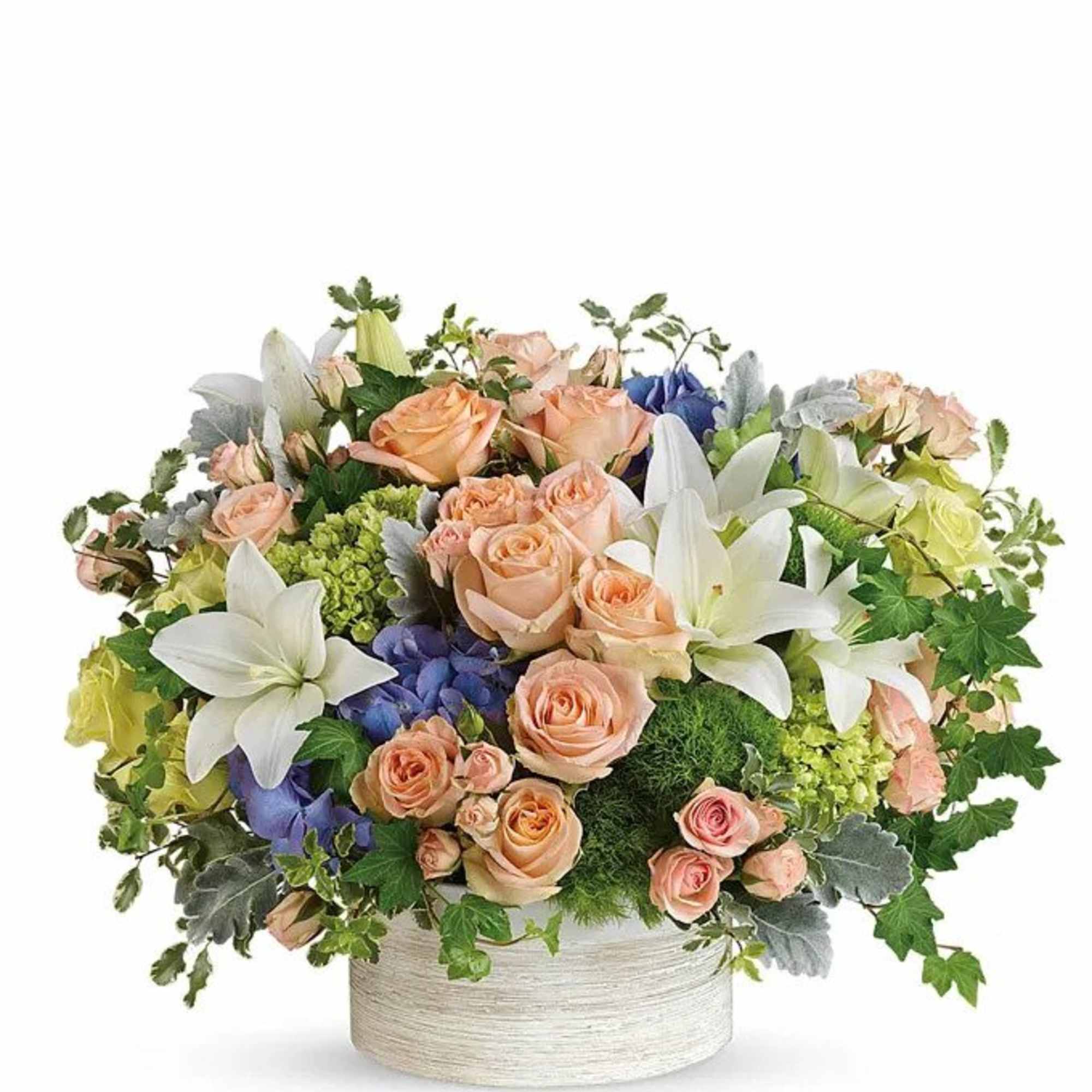 Mixed bouquet of peach roses, white lilies, and blue flowers in a round box