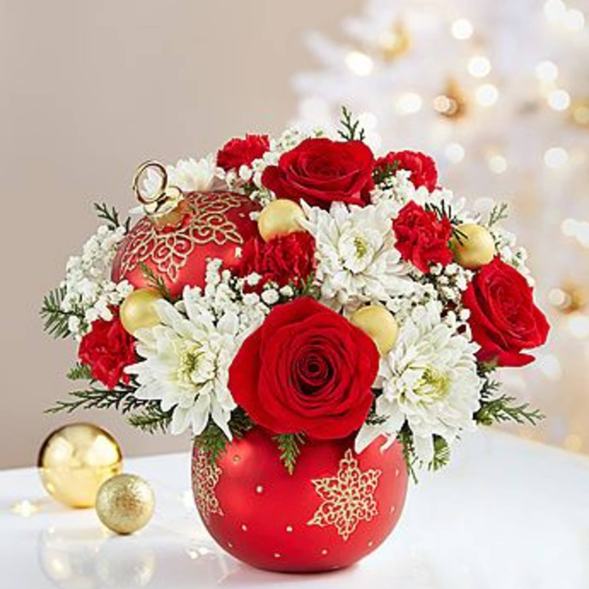 EXCLUSIVE Our floral designers have handcrafted an arrangement of roses, poms, carnations