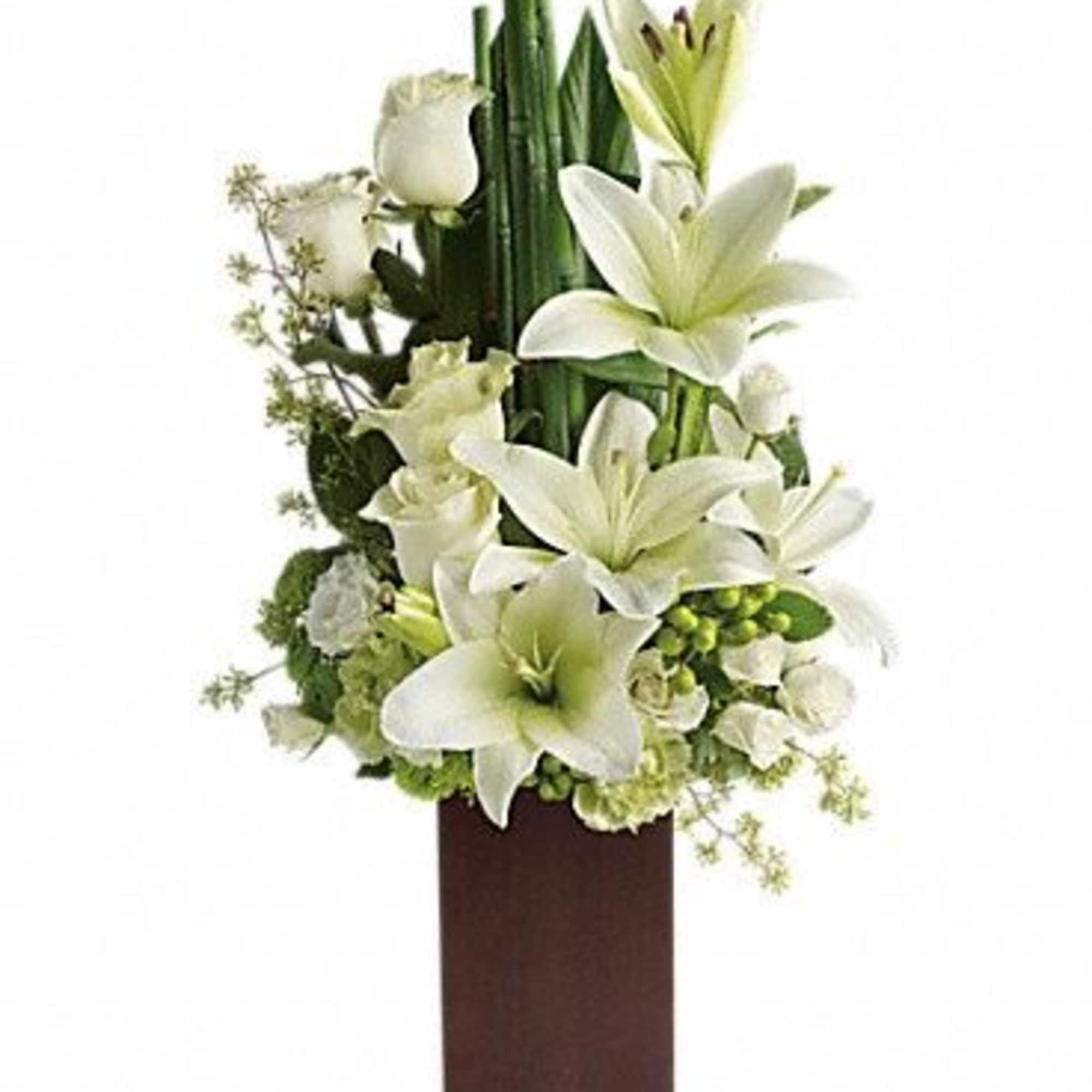 White lilies and roses arranged in a tall brown vase, photo 2 of 3