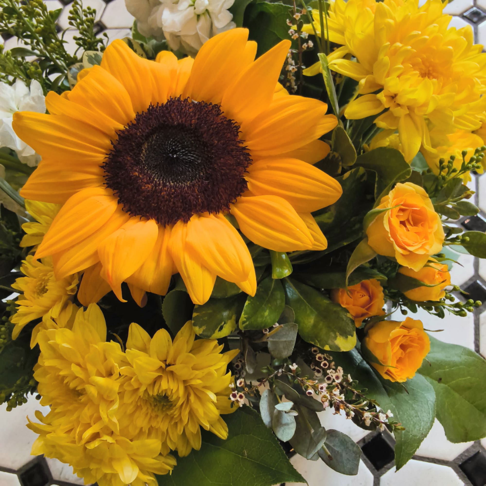 Sunflower bouquet with yellow chrysanthemums and orange roses