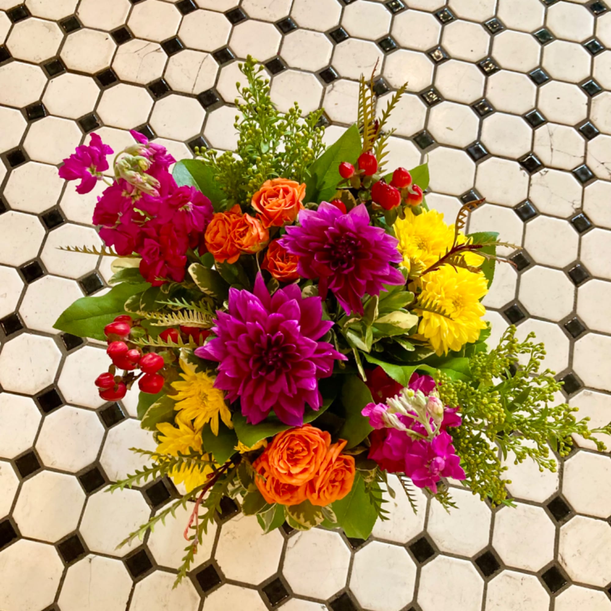Colorful bouquet with magenta, orange, and yellow flowers