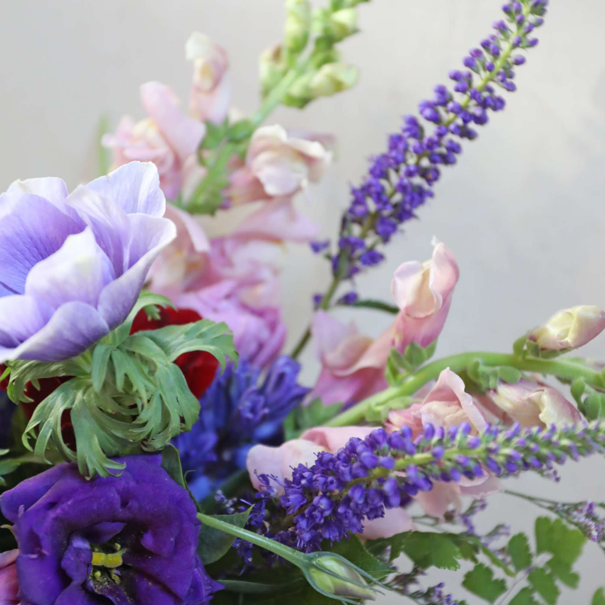 Bouquet of purple and pink flowers with tall lavender spikes