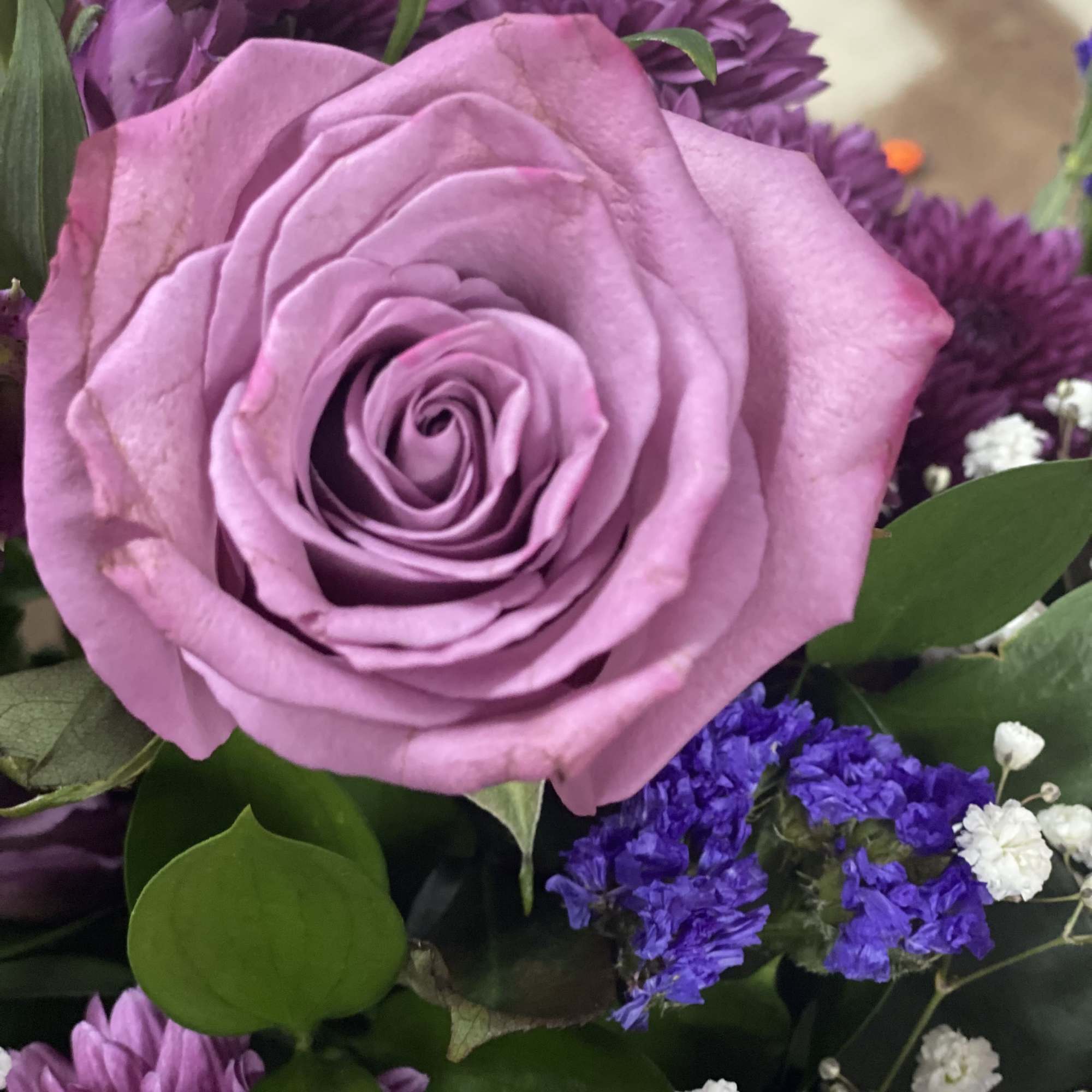 Purple elegance vase  
in a purple vase filled with purple and