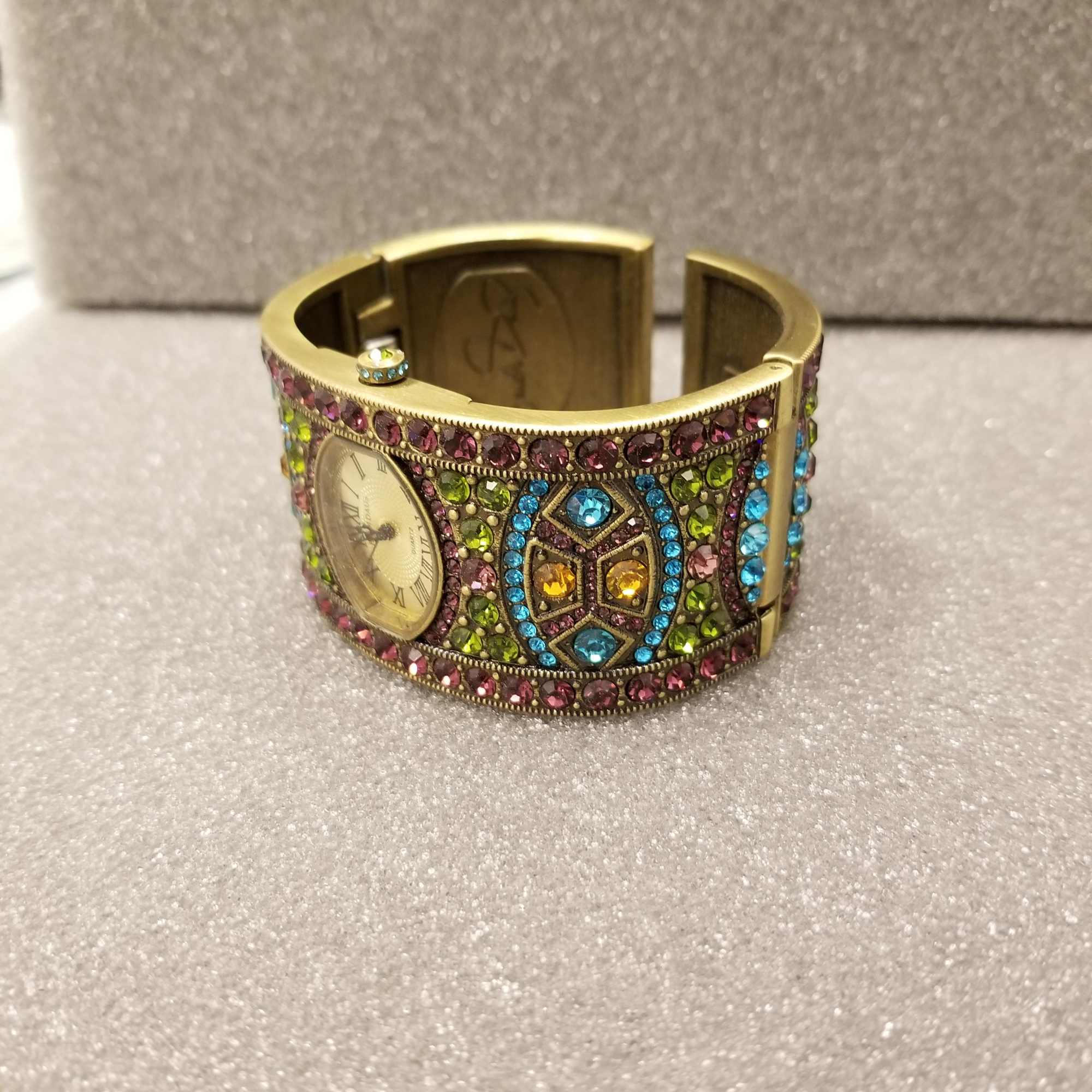 Hand crafted Art Deco Watch displaying all colors and hues, the settings