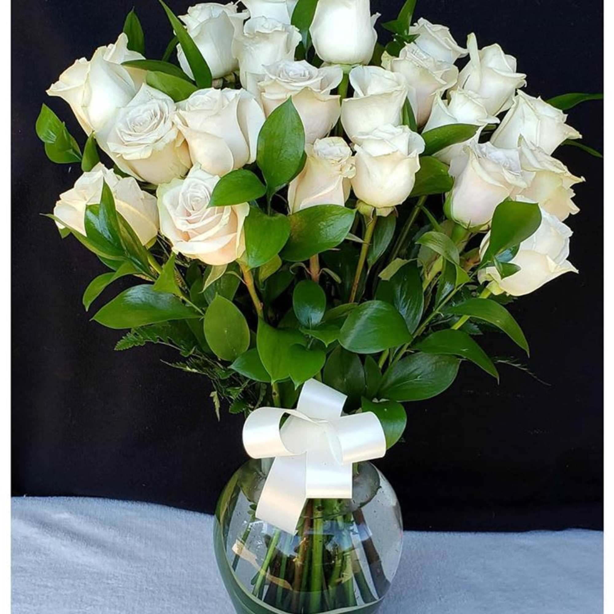Our pristine white roses are an elegant surprise for someone who brings
