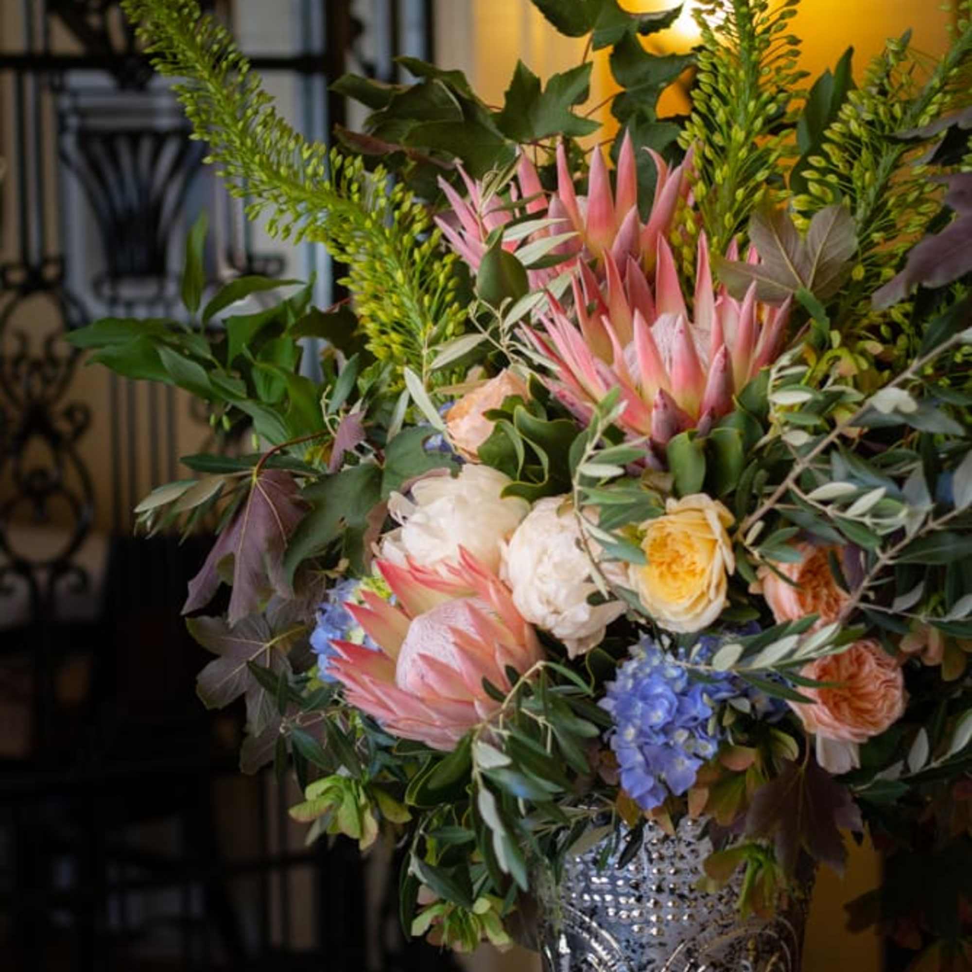 A grand bouquet of protea with other seasonal flowers that have soft, photo 3 of 4