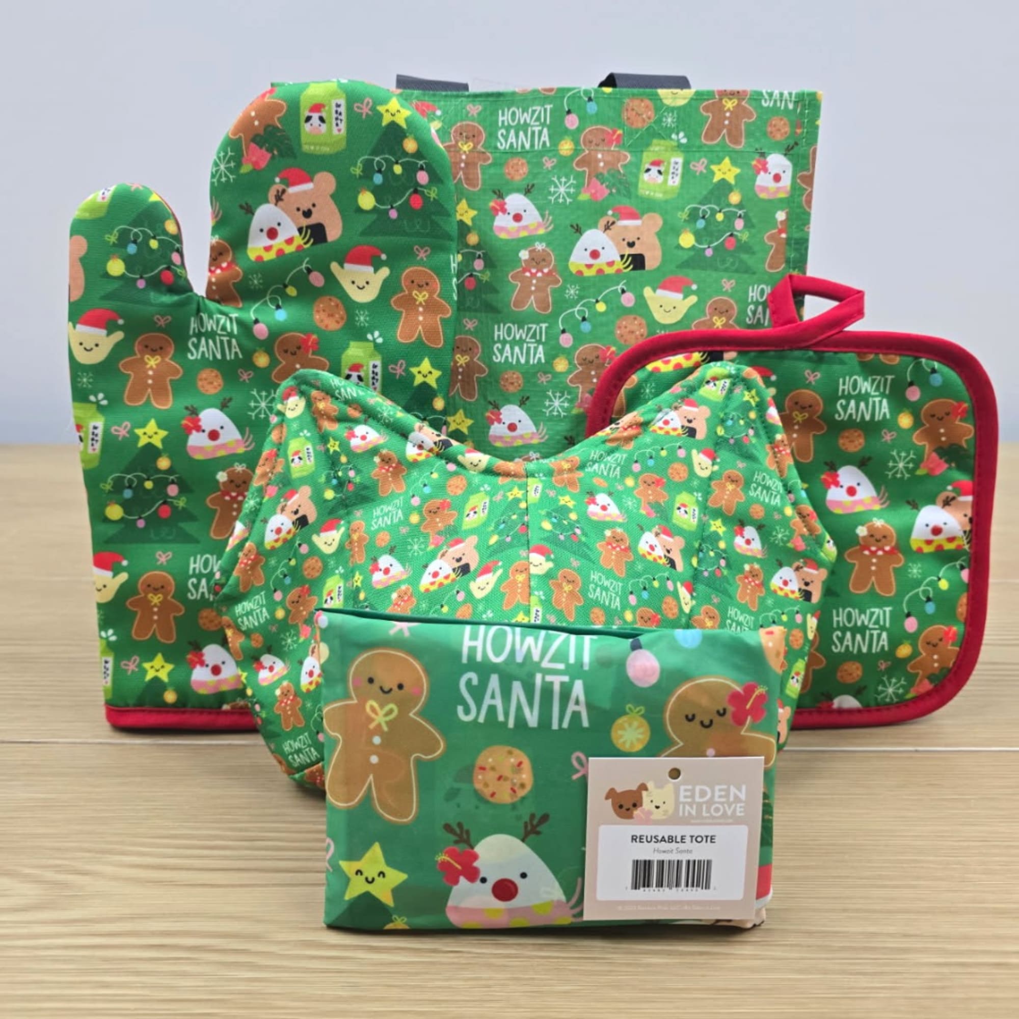 Christmas-themed reusable tote bags with gingerbread and Santa prints