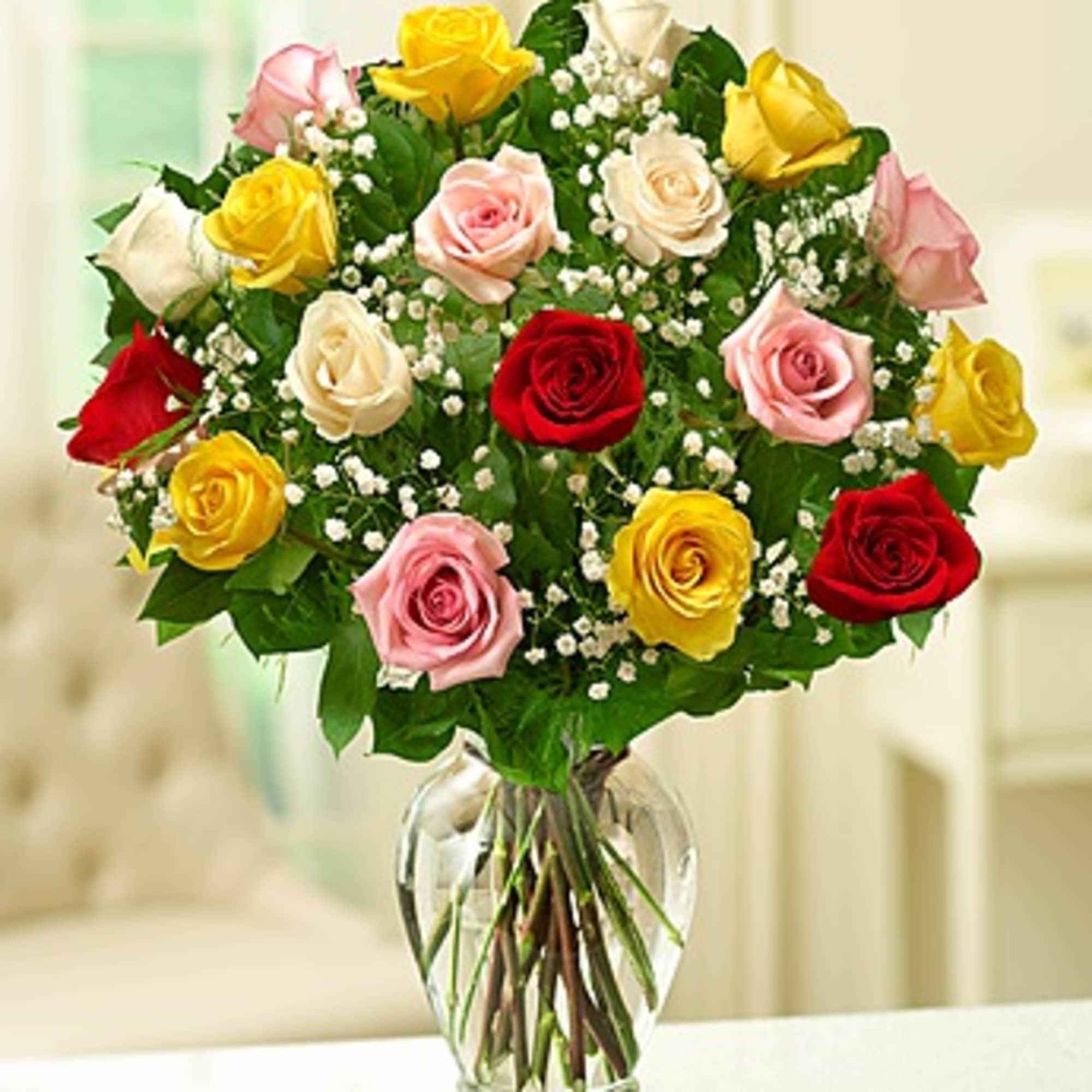Bouquet of multicolored roses in a clear glass vase, photo 2 of 2