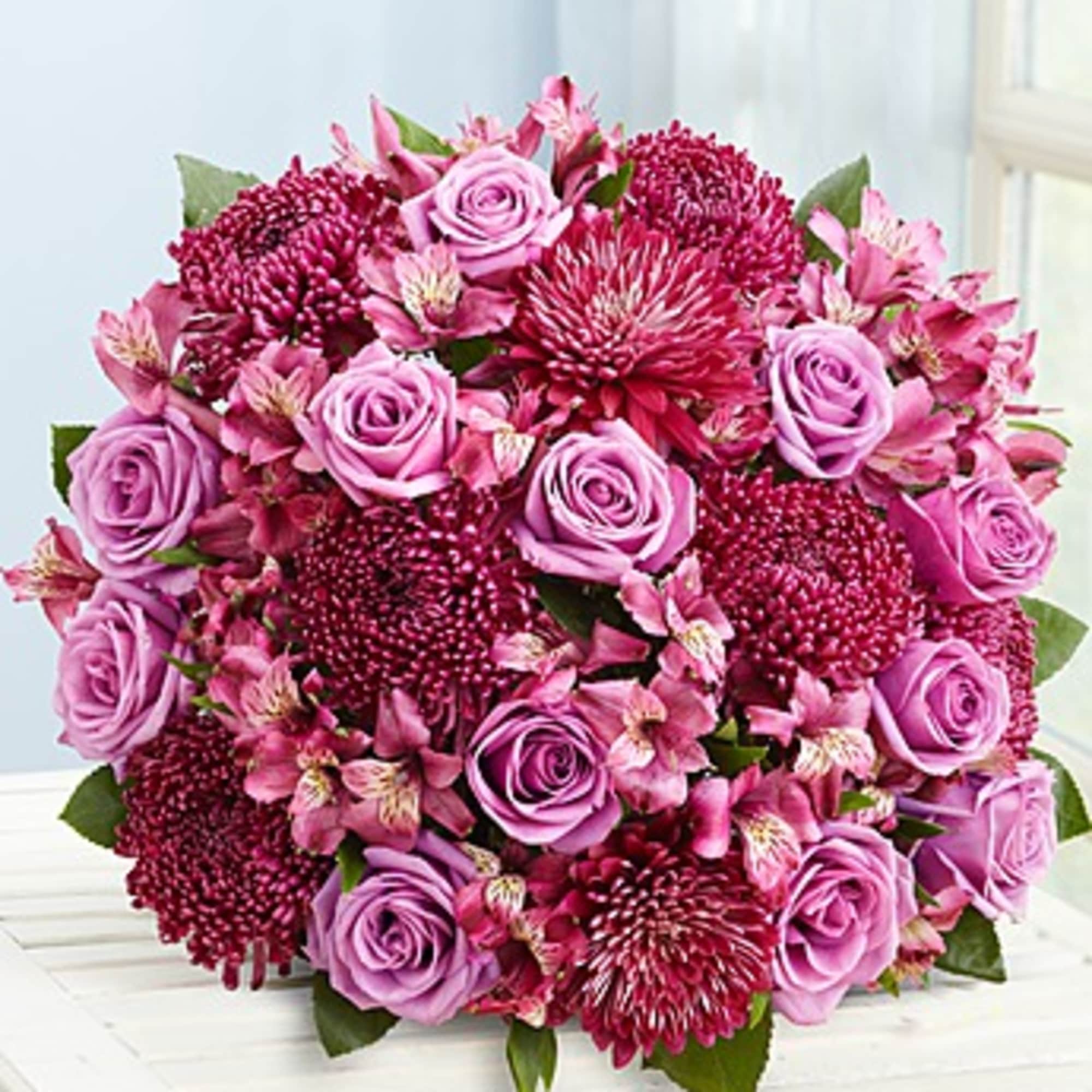 Pink and lavender bouquet of roses and chrysanthemums