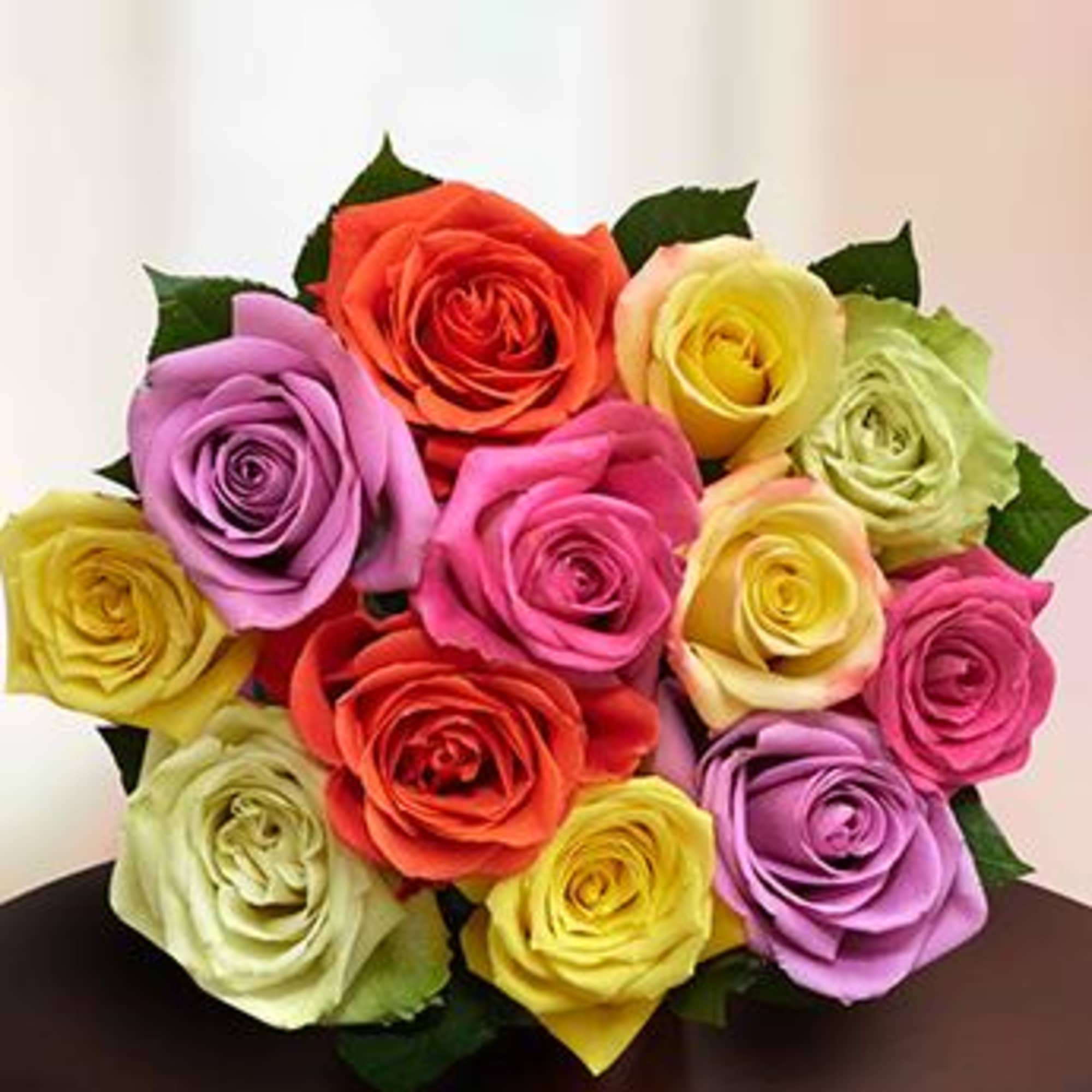Bouquet of multicolored roses in pink, purple, yellow, and orange