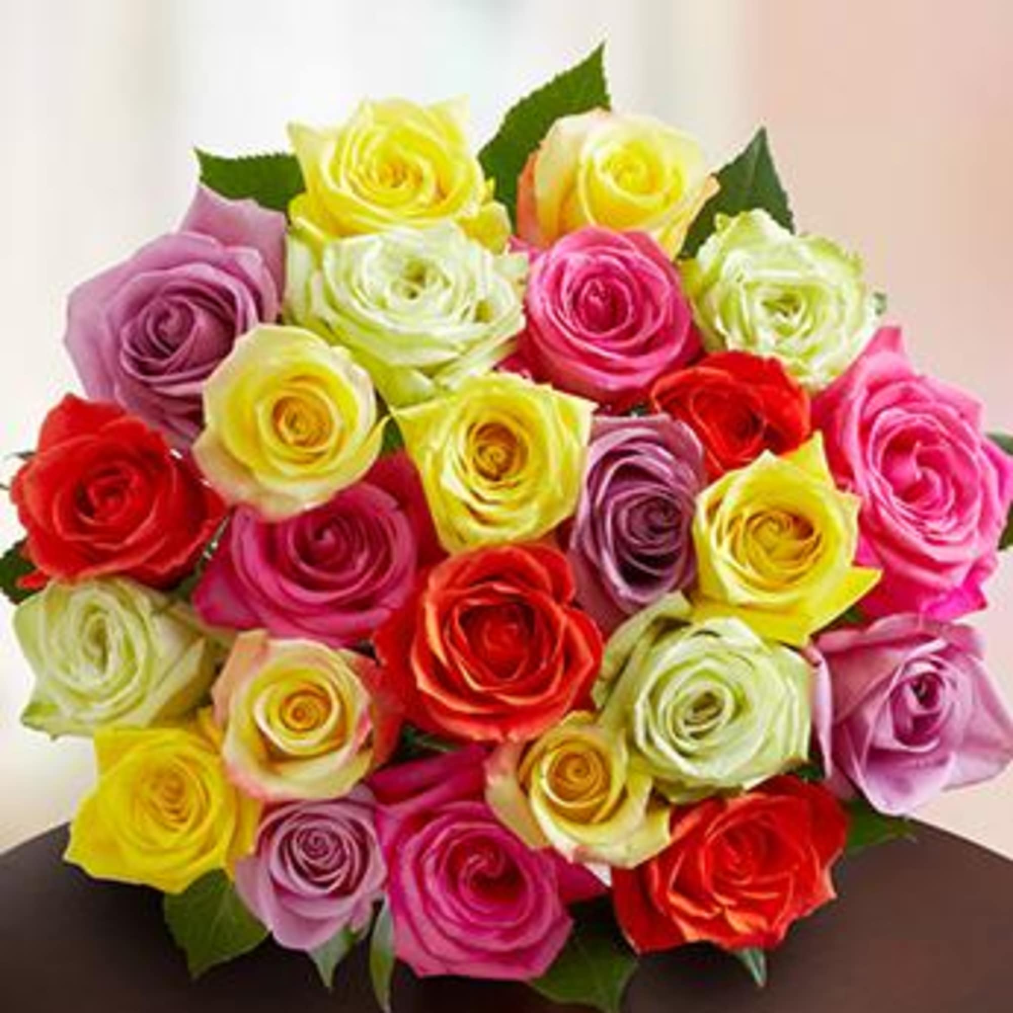 Bouquet of multicolored roses in pink, yellow, red, and lavender