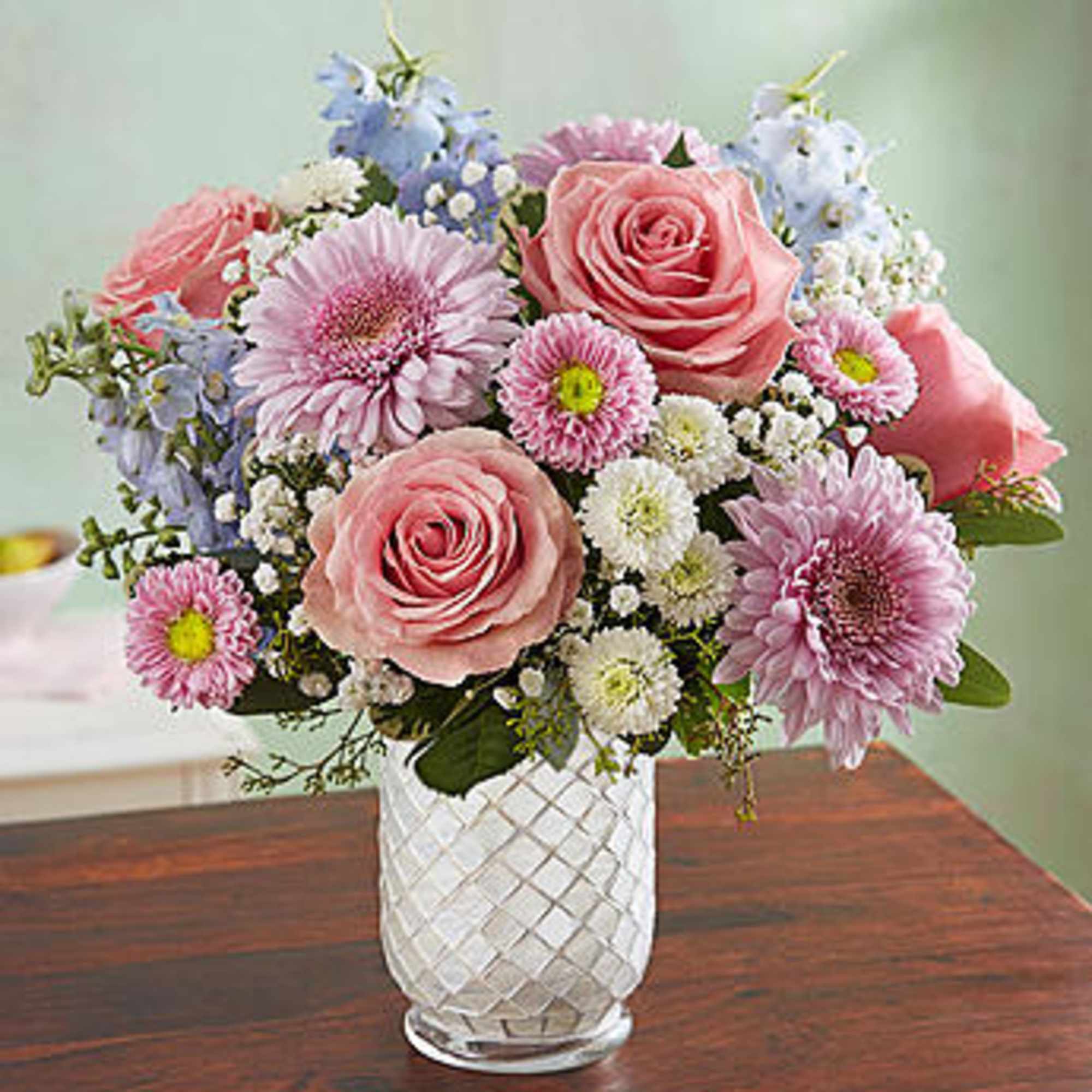 Pink and lavender mixed bouquet in a clear glass vase