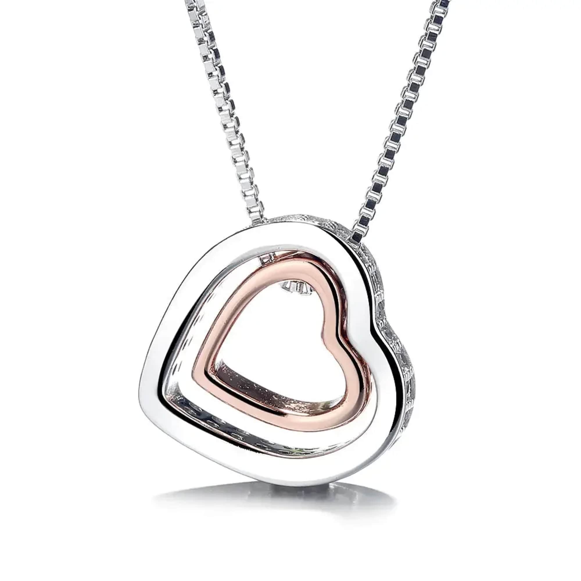 Heart-shaped silver pendant necklace with a rose gold inner heart