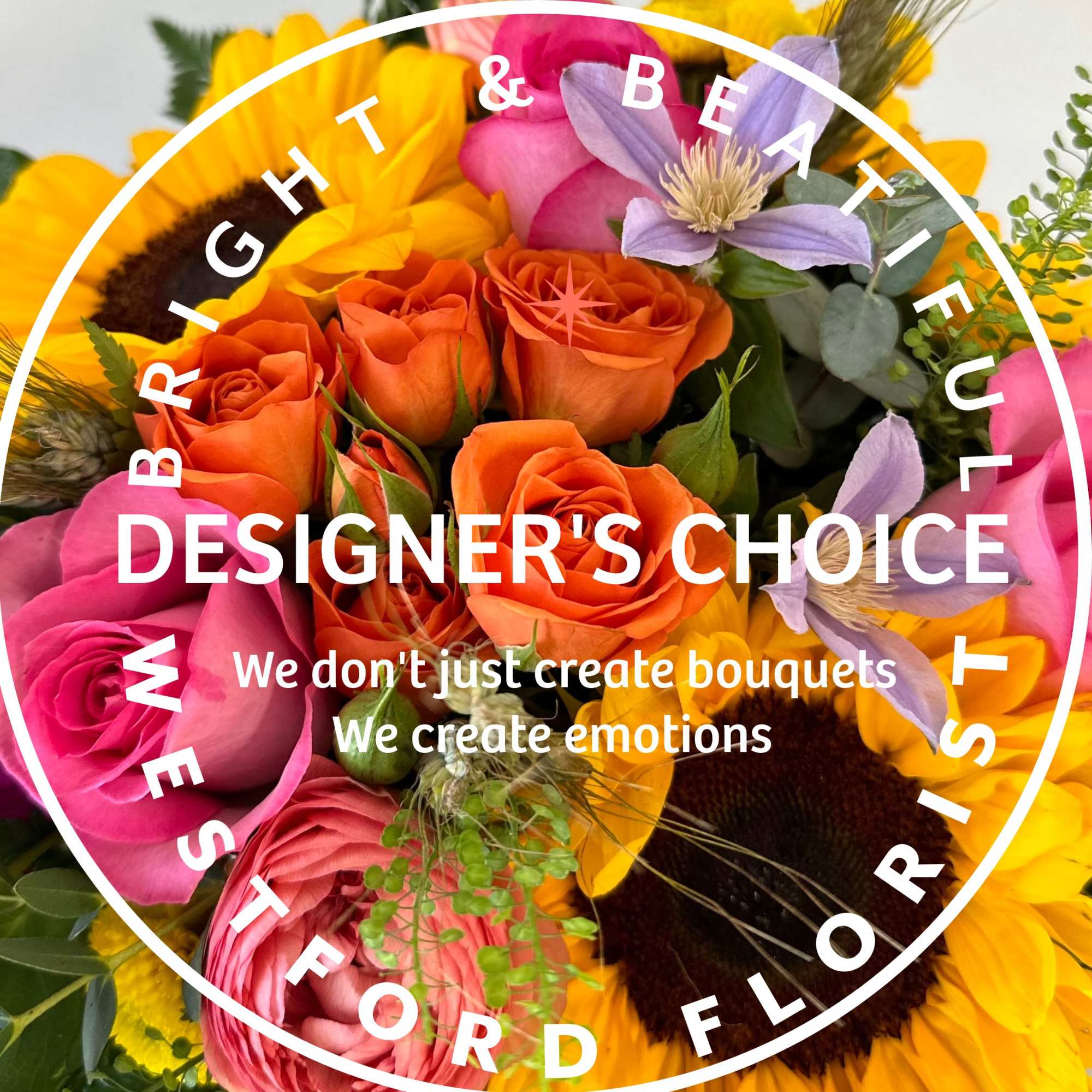 Bright mixed bouquet with sunflowers, orange and pink roses, and purple blooms with Designer's Choice text overlay.