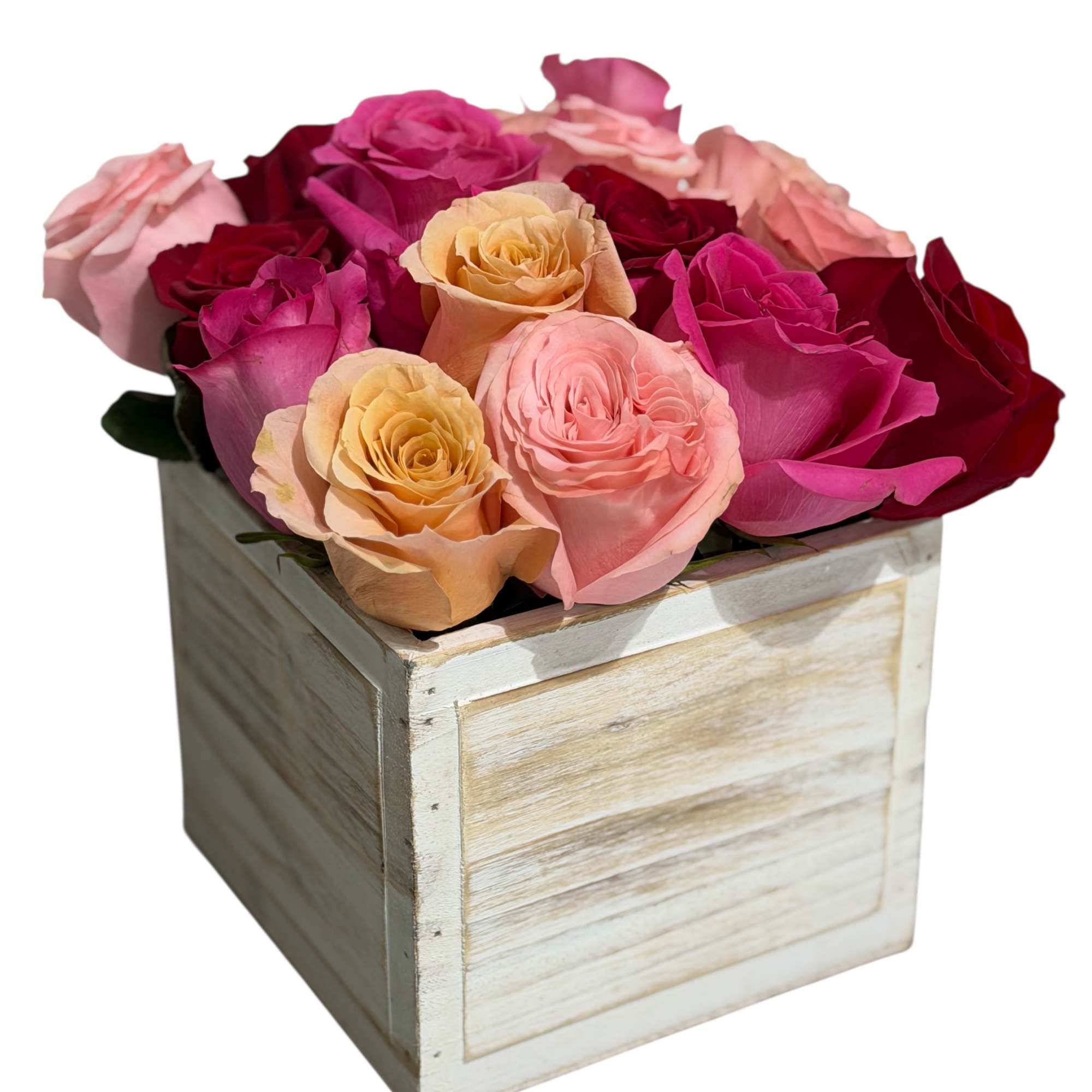 Pink, red, and peach roses arranged in a wooden box